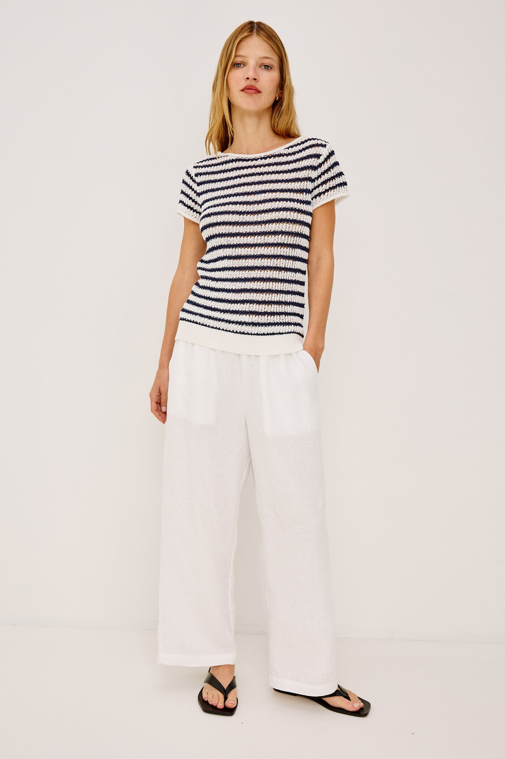 Cady Top in Semi-Sheer Linen-Blend Knit With Rolled Neckline, Cap Sleeves, and Classic Fit in Ivory Indigo Stripe Colorway - Full Body Front View Featured on Model
