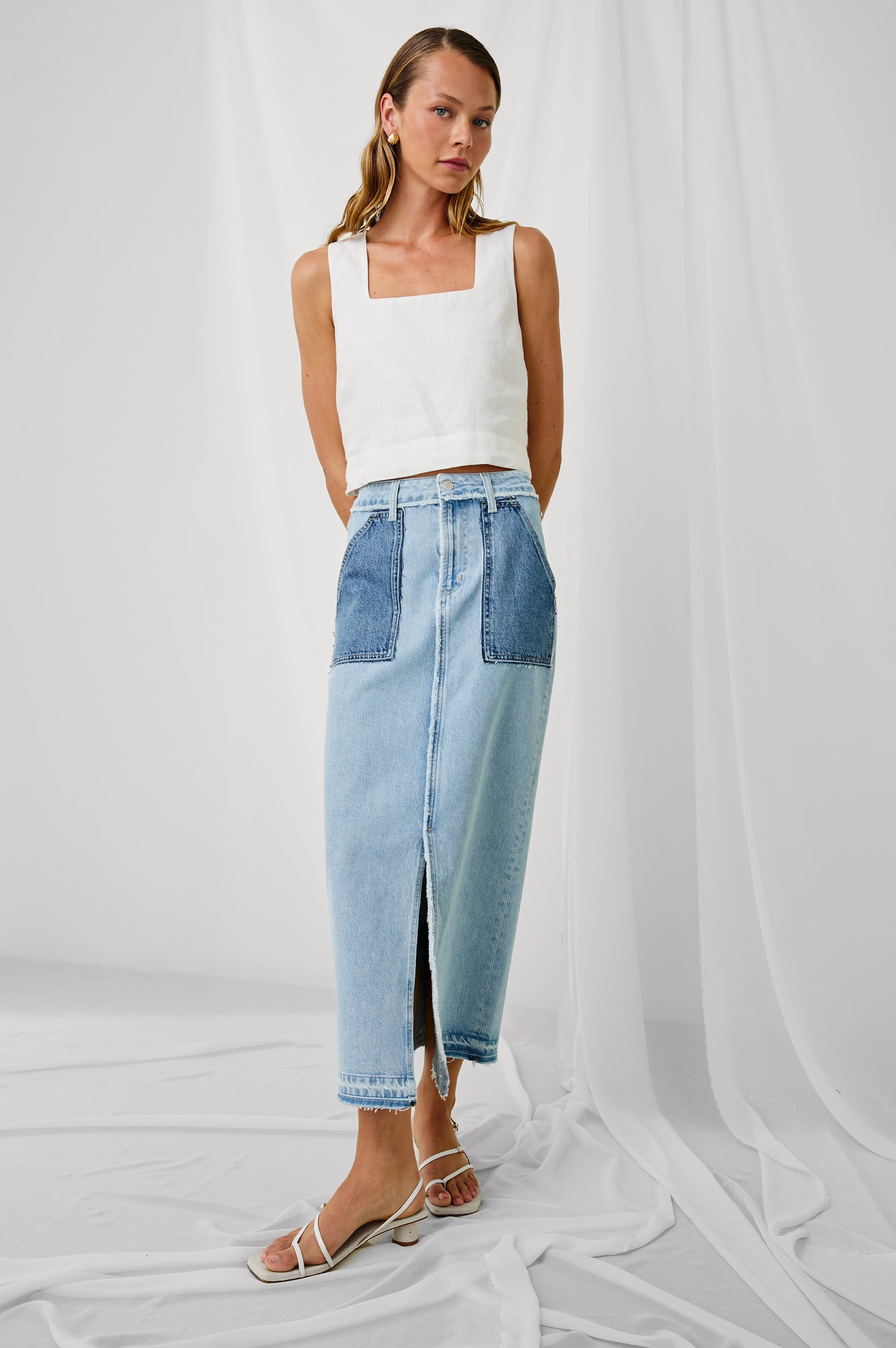 Calabasas high rise, long skirt with front slit and contrast wash pockets in Tattered Patchwork - full body front view on model