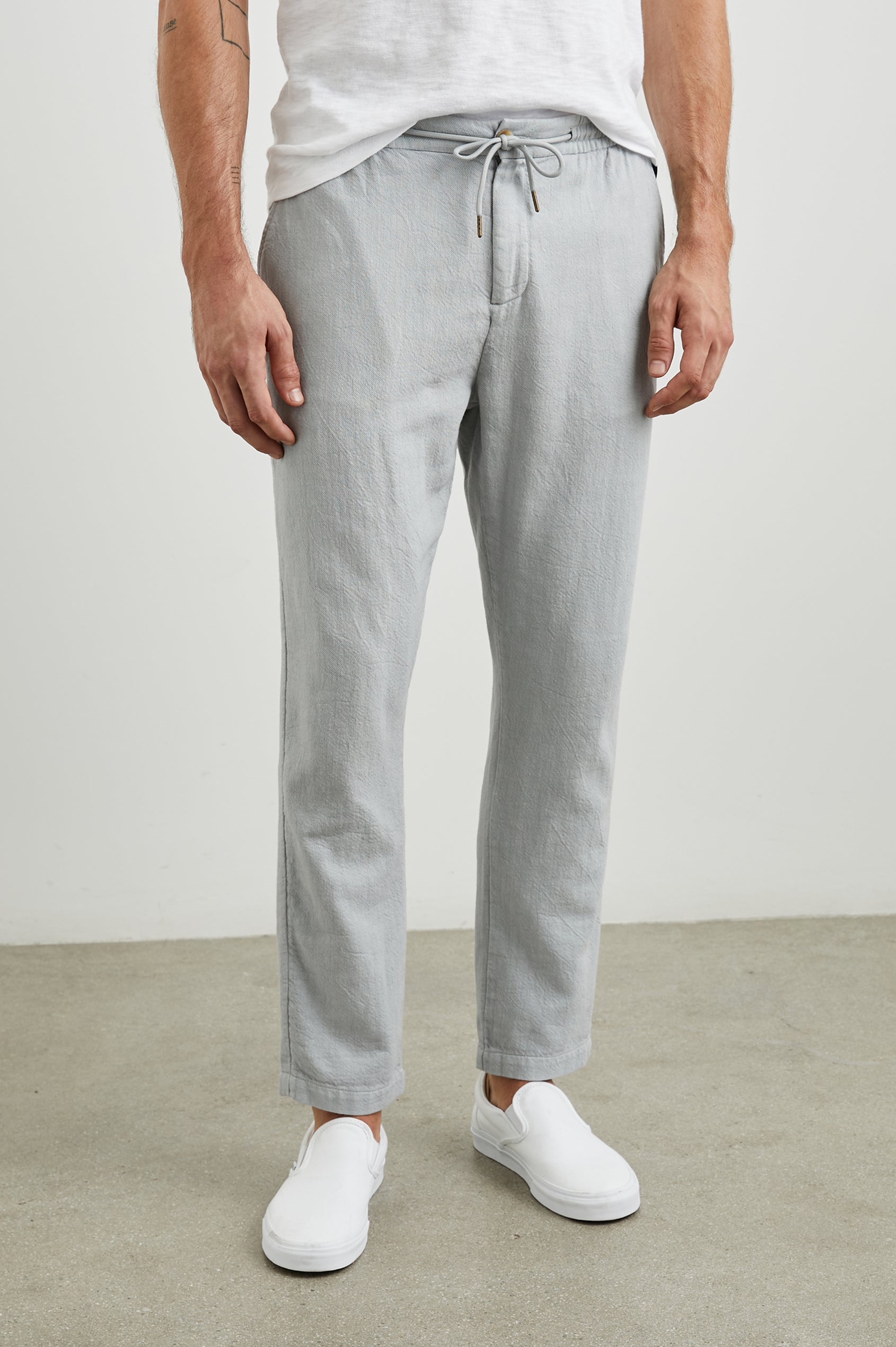 Callum Pants with a Drawstring Waist, Two Front Pockets and a Back Patch Pocket in Cement Colorway - Front View Featured on Model