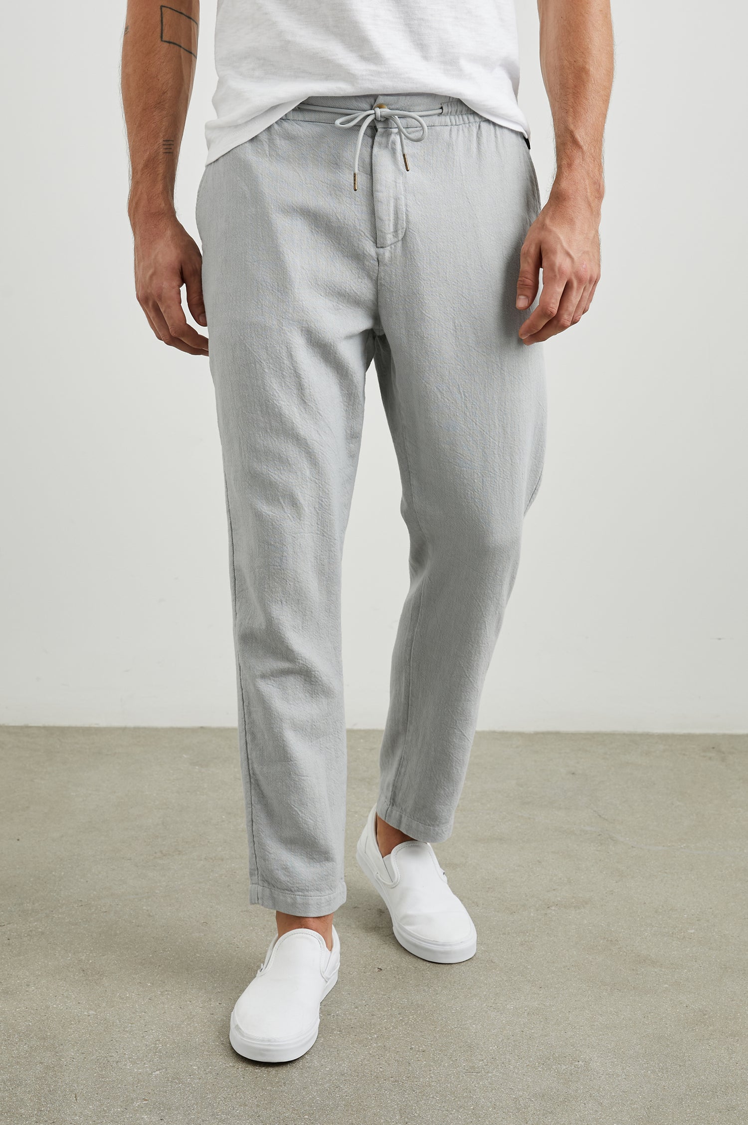 Callum Pants with a Drawstring Waist, Two Front Pockets and a Back Patch Pocket in Cement Colorway - Front View Featured on Model
