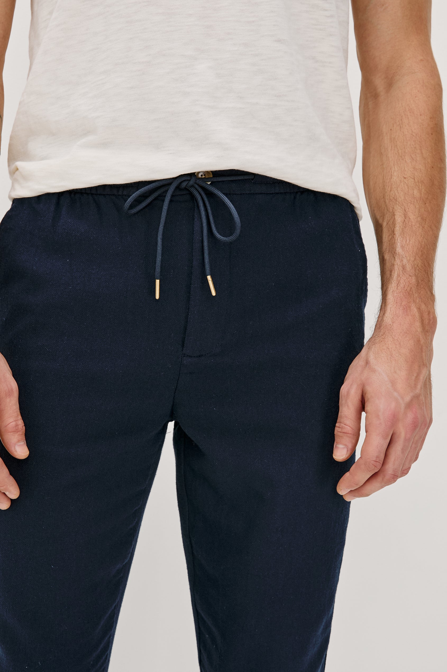 Callum extended length linen straight leg pant with elastic waistband and adjustable drawstring in Deep Meridian - close up of details on model