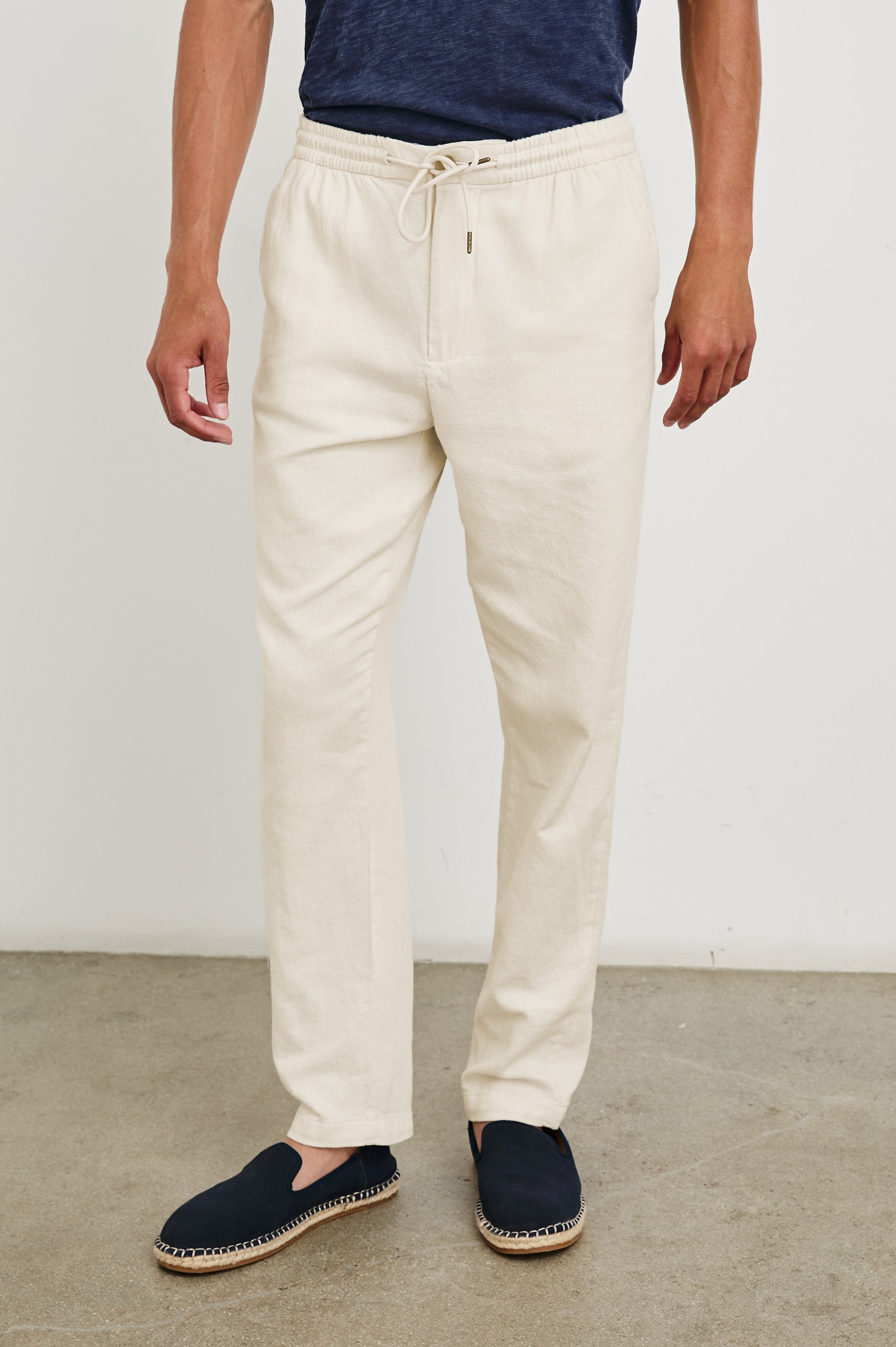 Callum Pants with a Drawstring Waist, Two Front Pockets and a Back Patch Pocket in Ecru Colorway - Front View Featured on Model