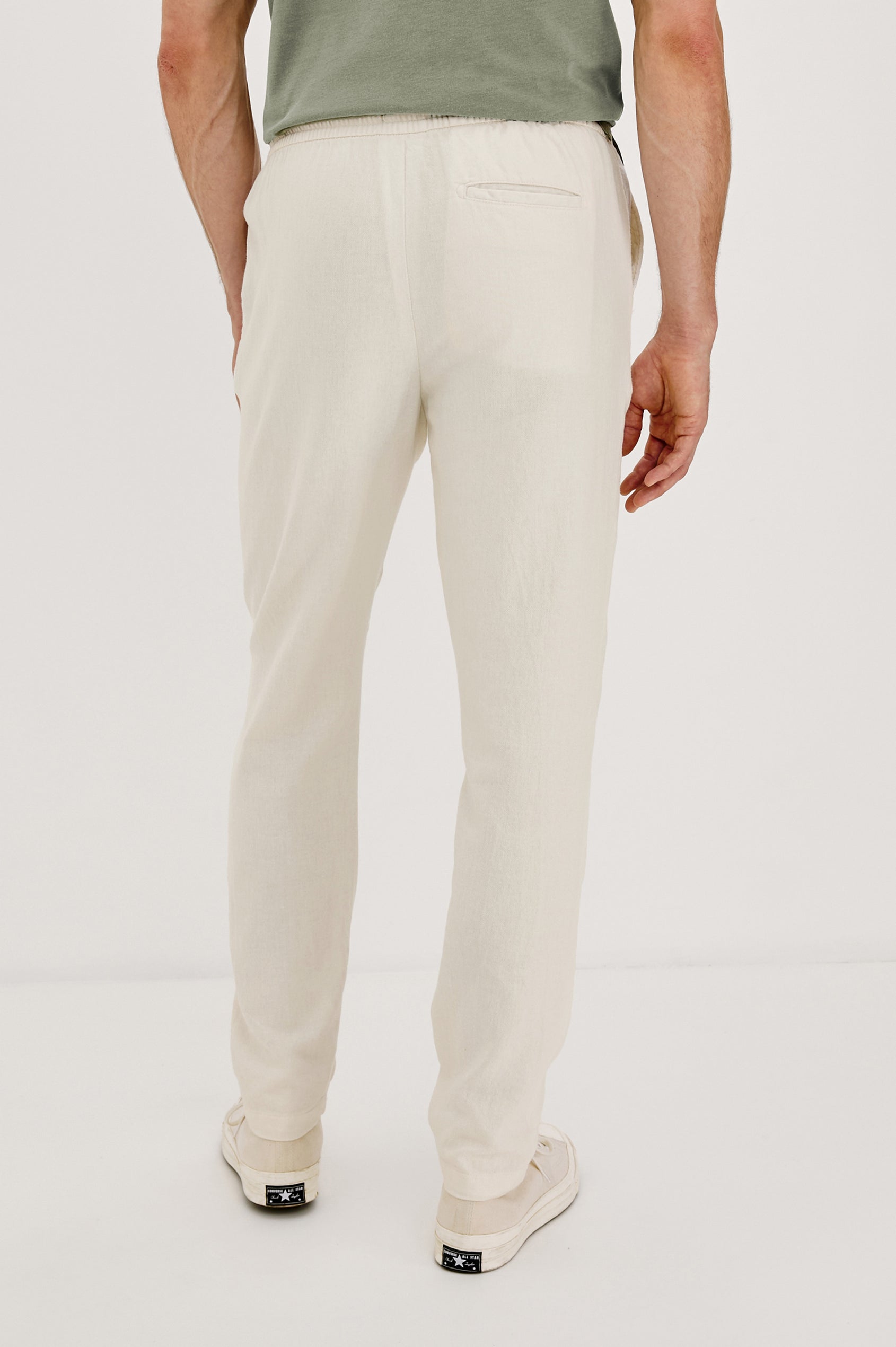 Callum extended length linen straight leg pant with elastic waistband and adjustable drawstring in Ecru - back view on model