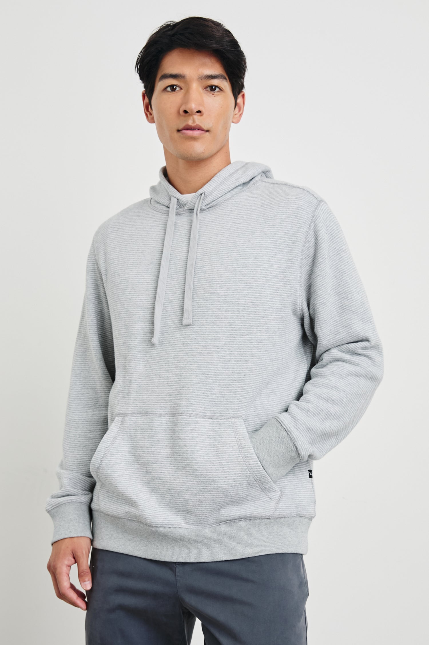 Calvin Long-Sleeve Hoodie with a Drawstring Hood and a Kangaroo Pocket in Heather Cream Stripe Colorway, Horizontal Stripes - Front View Featured on Model 