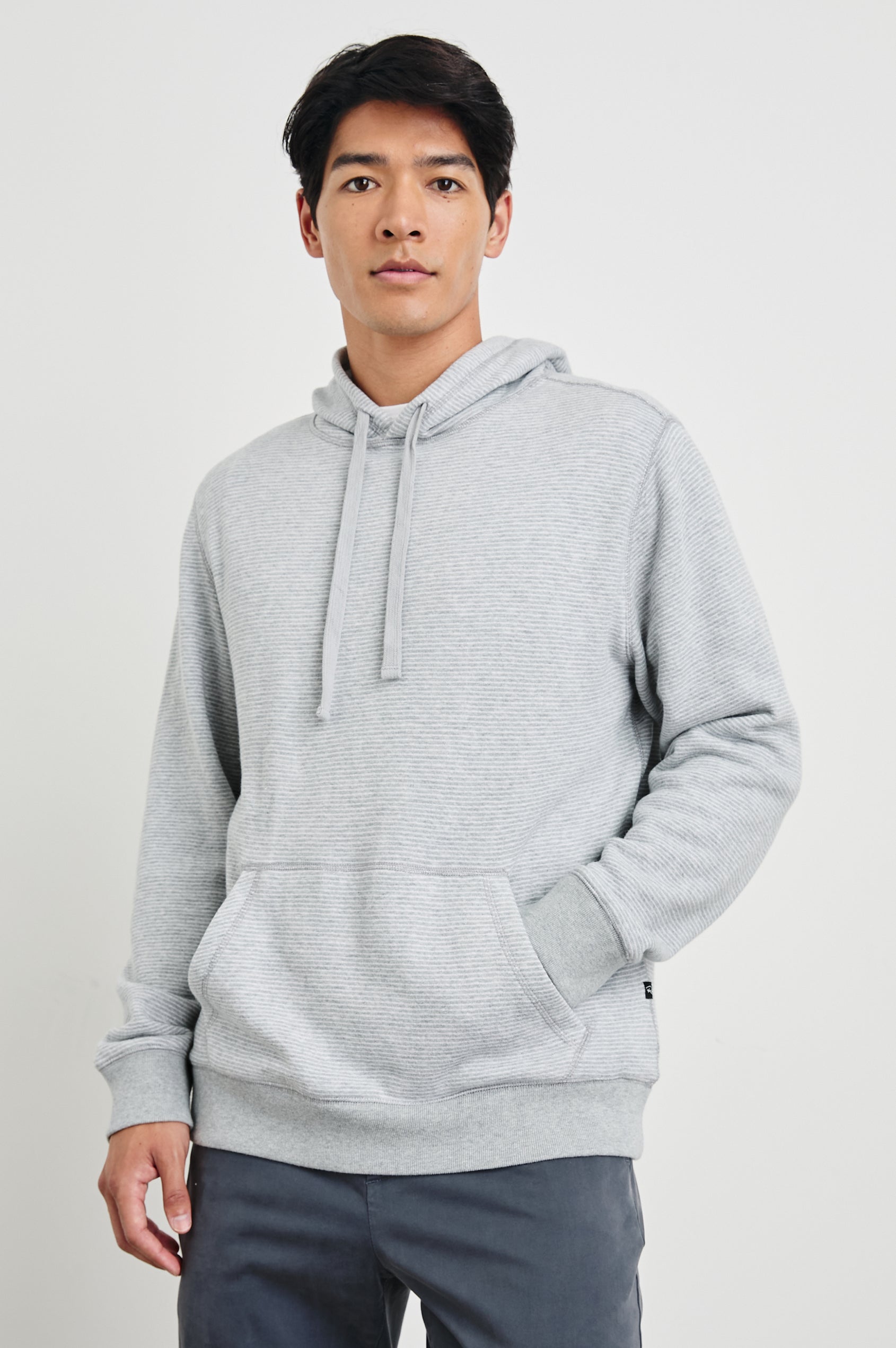Calvin Long-Sleeve Hoodie with a Drawstring Hood and a Kangaroo Pocket in Heather Cream Stripe Colorway, Horizontal Stripes - Front View Featured on Model 