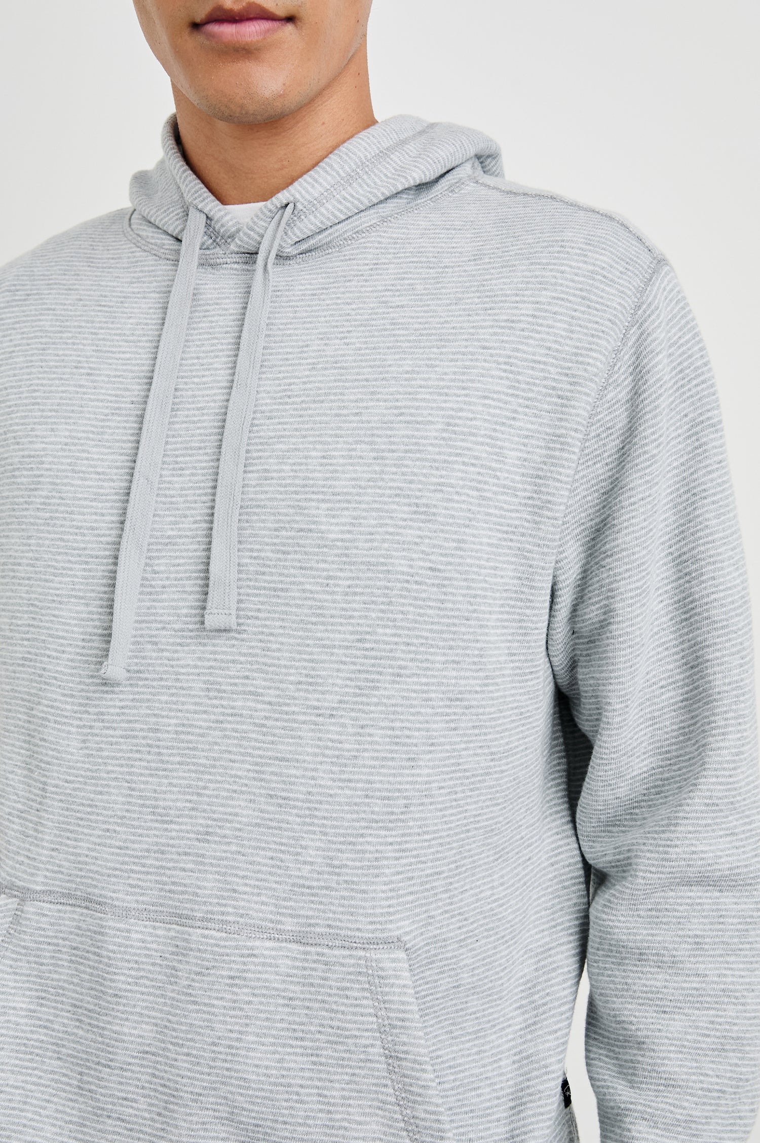 Calvin Long-Sleeve Hoodie with a Drawstring Hood and a Kangaroo Pocket in Heather Cream Stripe Colorway, Horizontal Stripes - Front View Featured on Model 