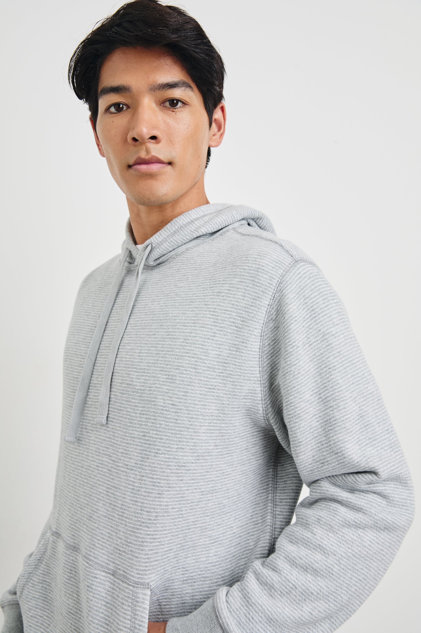 Calvin Long-Sleeve Hoodie with a Drawstring Hood and a Kangaroo Pocket in Heather Cream Stripe Colorway, Horizontal Stripes - Front View Featured on Model 