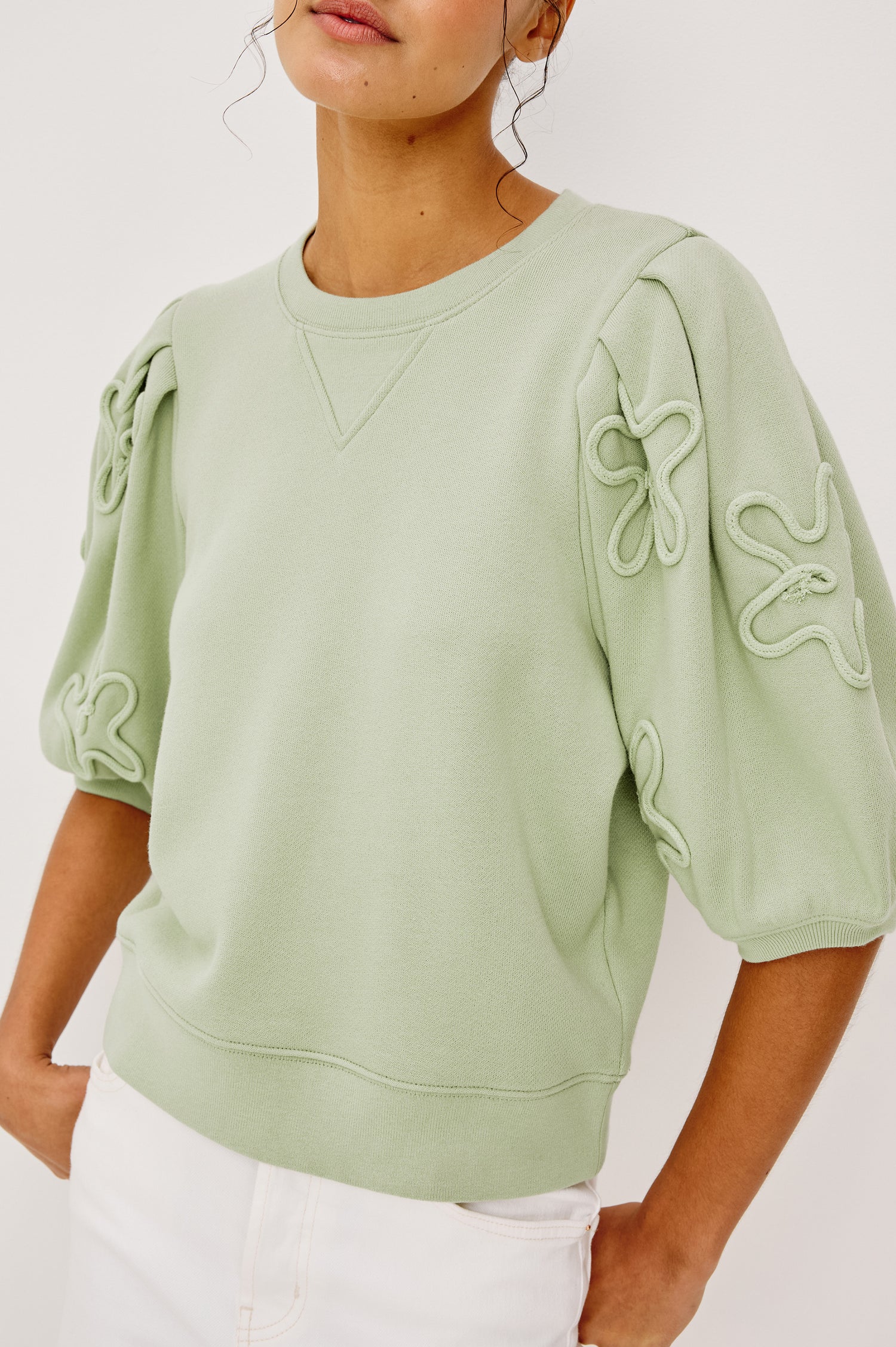Camy Crewneck Sweatshirt in French Terry With Crew Neckline Soutached Florals and Puff Sleeves in Vintage Sage Colorway - Upper Body Close Up View Featured on Model