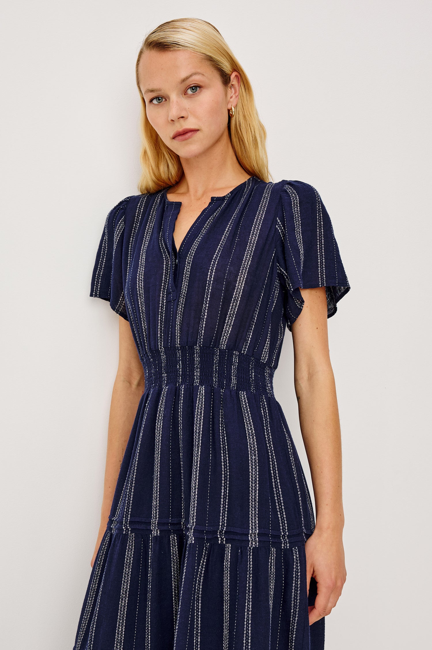 Cannes Midi Dress in Linen With Front Placket Short Sleeves and Smocked Elastic Waist in Marina Stripe Colorway - Upper Body Front View Featured on Model