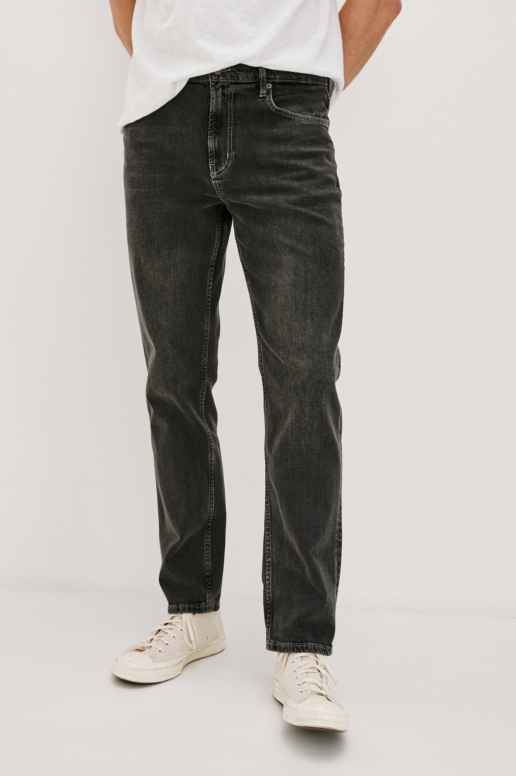 Clayton Slim Straight Jeans with Belt Loops, Two Front Pockets plus a Coin Pocket and Two Back Patch Pockets in Reever 5 Year Colorway, a Washed Black - Front View Featured on Model