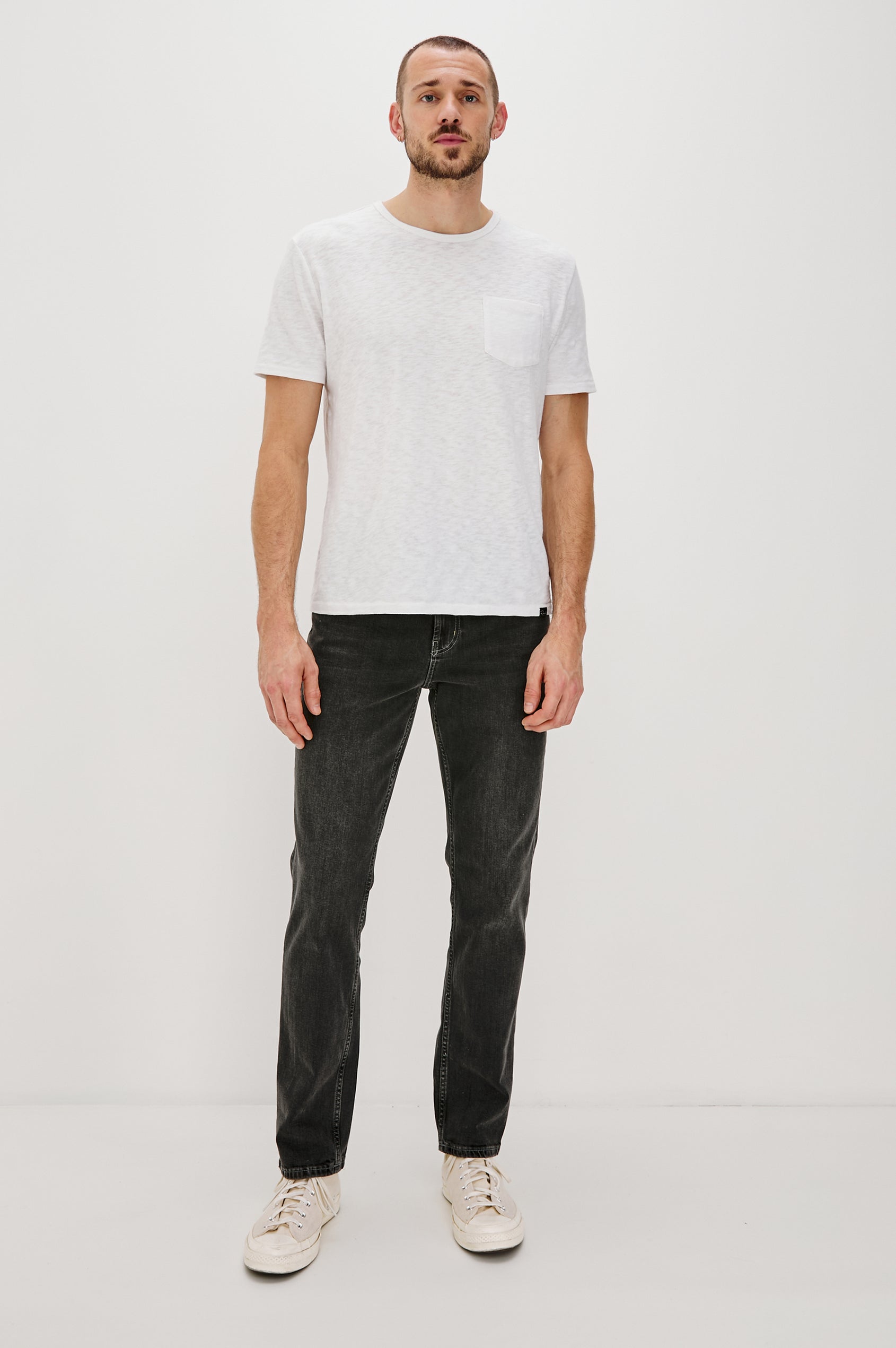 Clayton Slim Straight Jeans with Belt Loops, Two Front Pockets plus a Coin Pocket and Two Back Patch Pockets in Reever 5 Year Colorway, a Washed Black - Front Full Body View Featured on Model