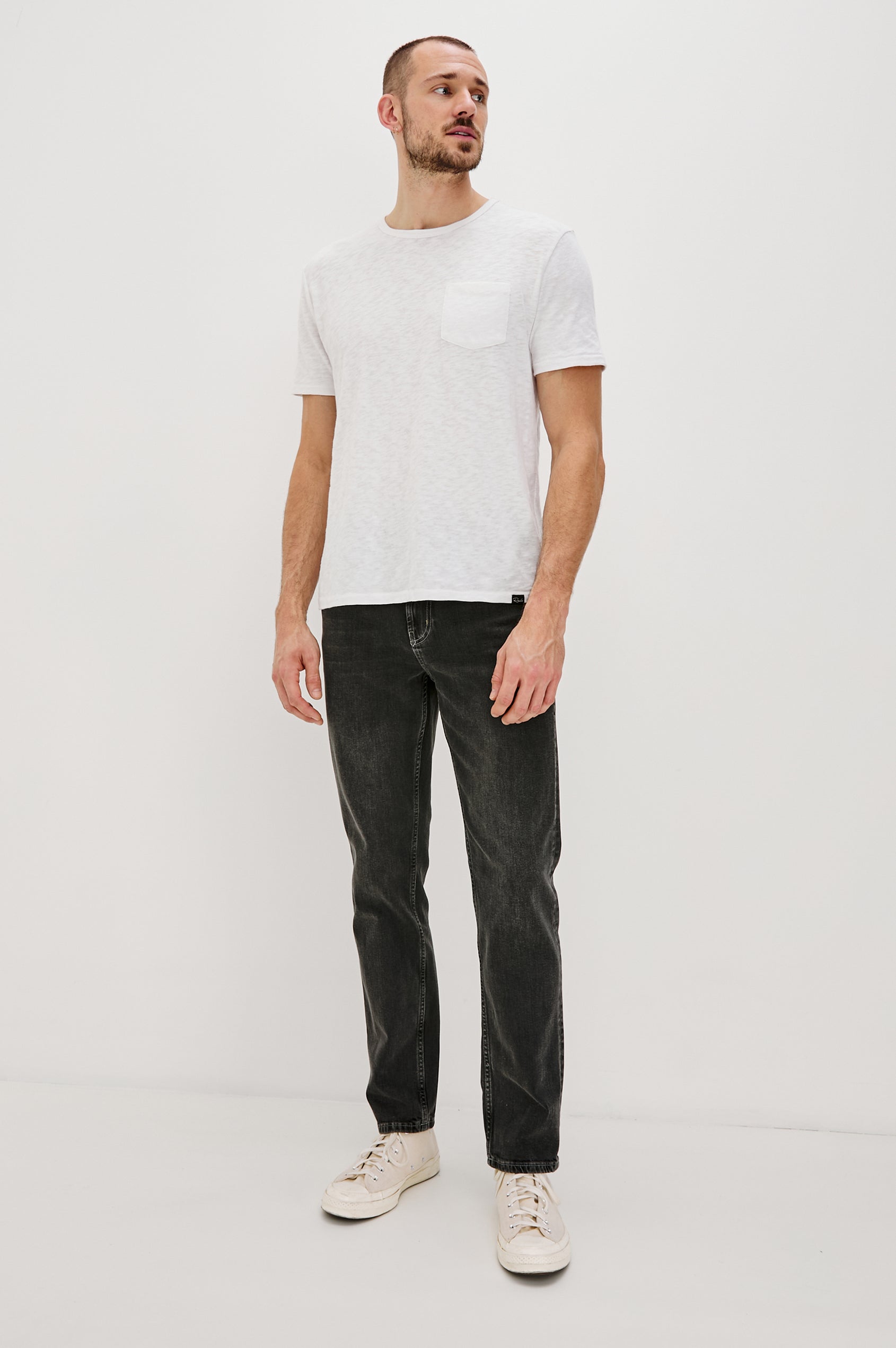 Clayton Slim Straight Jeans with Belt Loops, Two Front Pockets plus a Coin Pocket and Two Back Patch Pockets in Reever 5 Year Colorway, a Washed Black - Front Full Body View Featured on Model