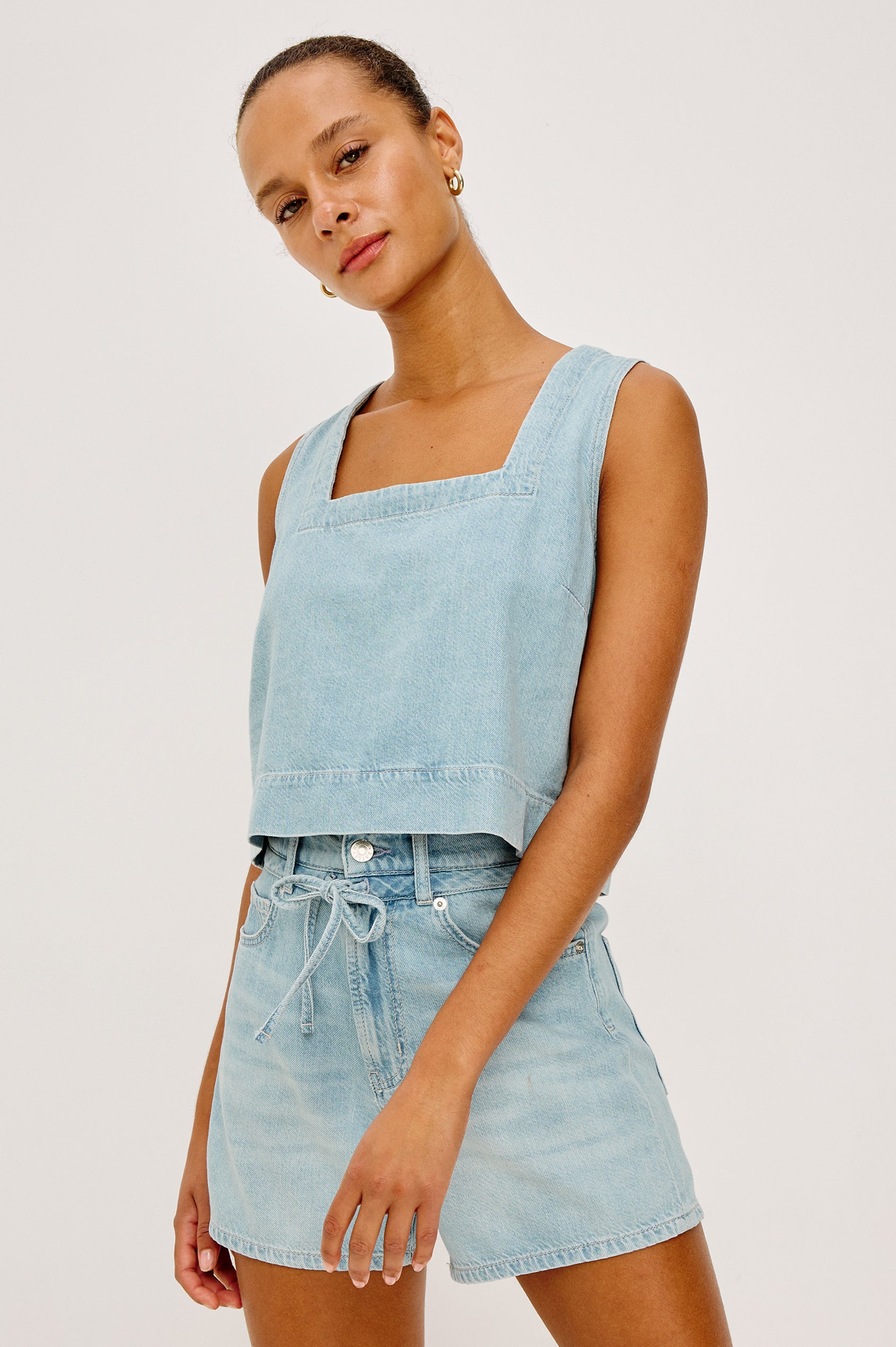 Carbon Crop Tank Top in Cotton Lyocell Denim With Square Neckline, Wide Shoulder Straps, and a Loose, Boxy Fit in Surf Colorway - Upper Body Front View Featured on Model