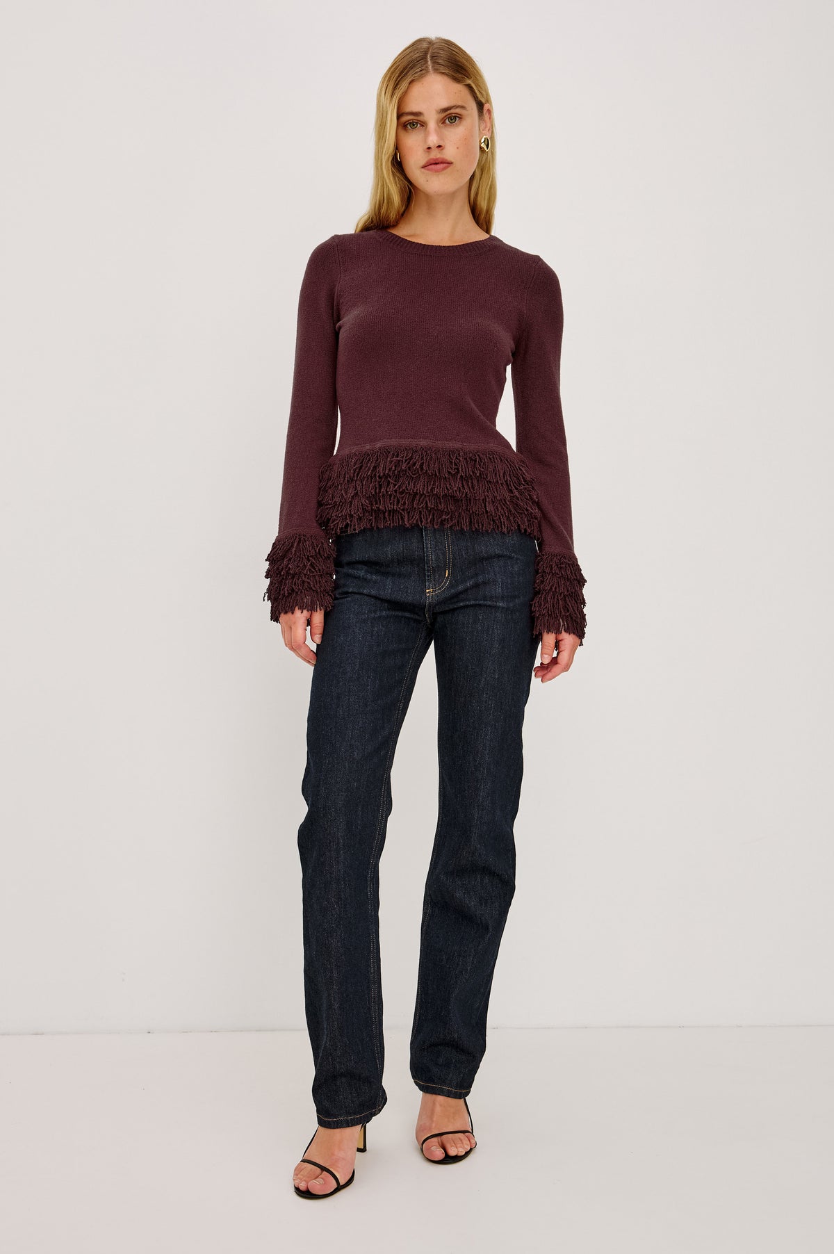 Carmen Sweater in Ribbed Knit With Fringe Trim Hem and Cuffs, Crew Neck, and Long Sleeves in Wine Colorway - Full Body Front View Featured on Model.