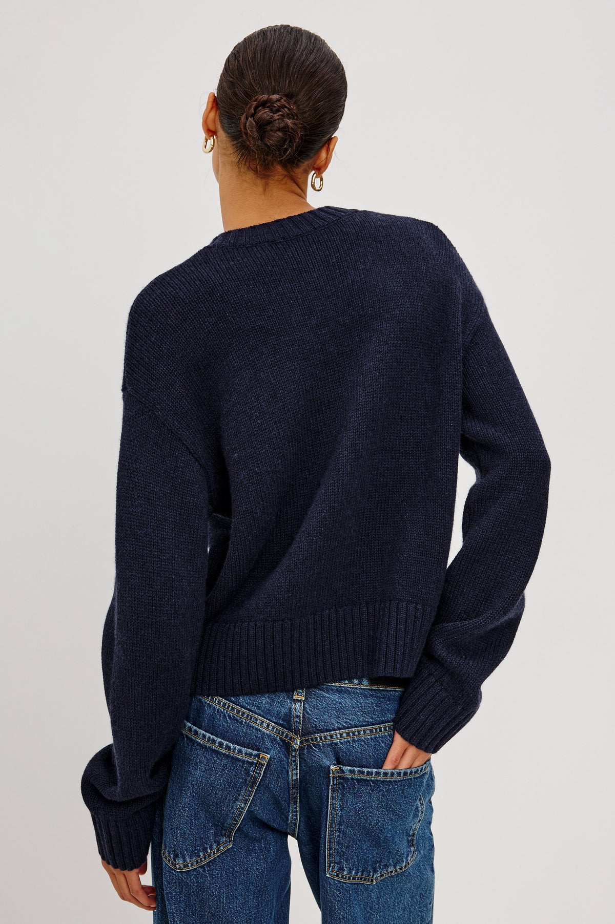 Carre Cardigan in Wool-Cashmere Blend With Relaxed Slightly Boxy Fit, Crew Neckline, Front Buttons, Long Sleeves, and Chunky Rib Trim in Navy Colorway - Upper Body Back View Featured on Model