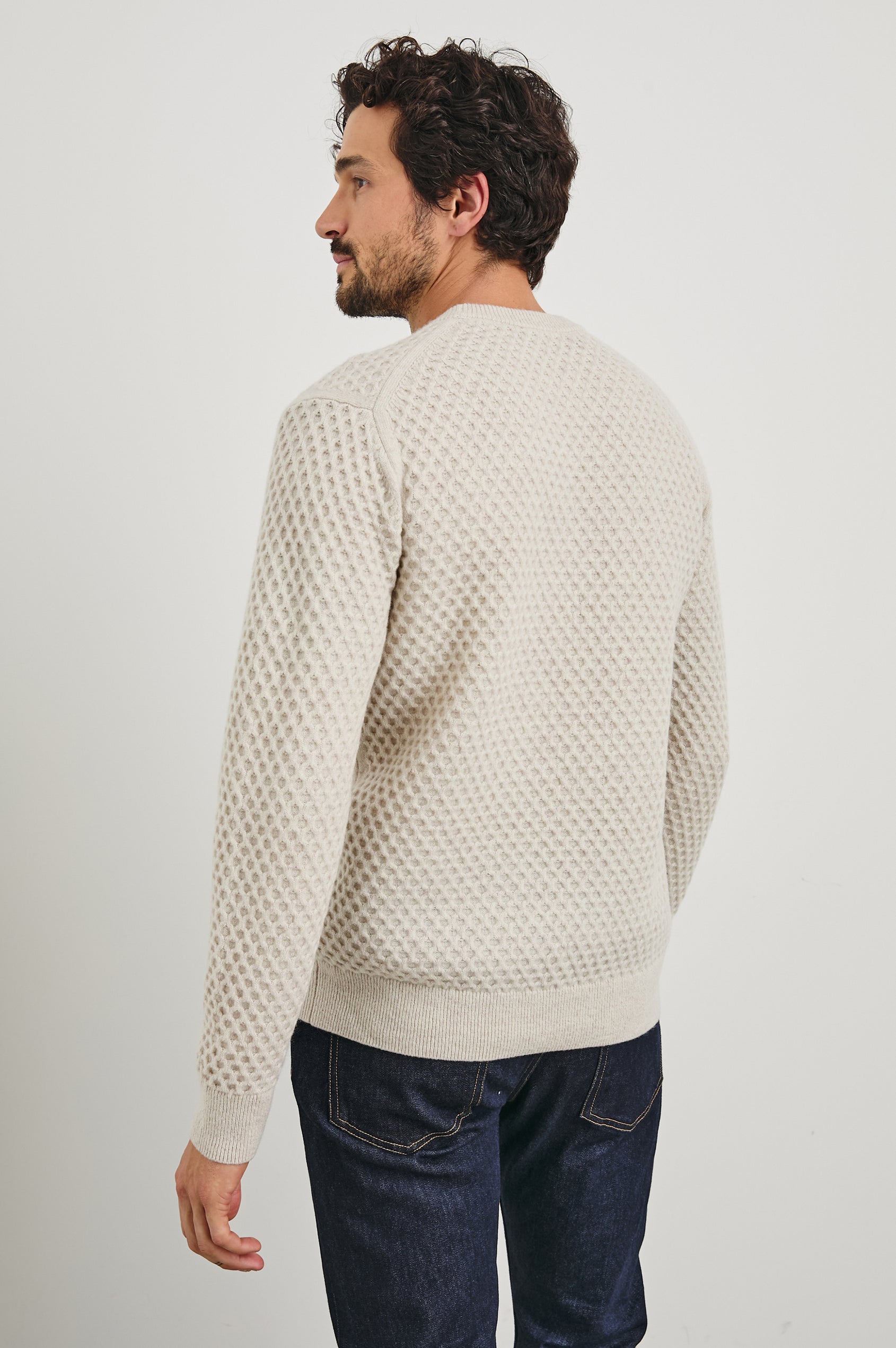 Carrick Long-Sleeve Sweater with a Crew Neck, Honeycomb Stitch, and Ribbed Trim in Oatmeal Heather Colorway - Back View Featured on Model