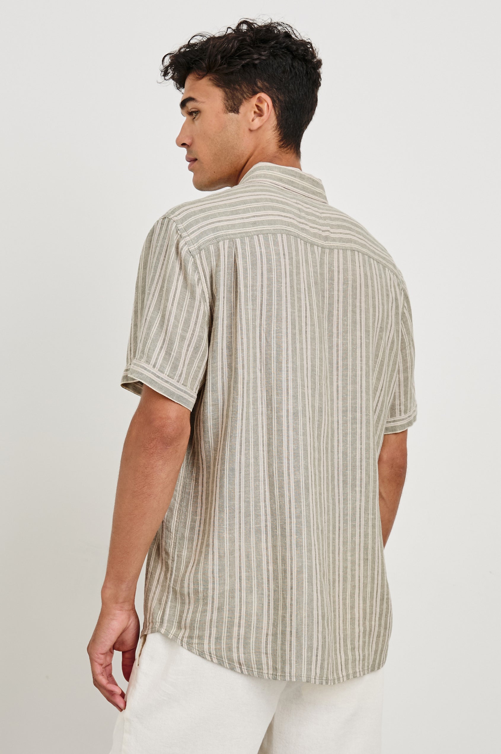 Carson linen short sleeve button down with a collar and neutral textured stripe pattern in Almond Mauve Stripe - back view on model