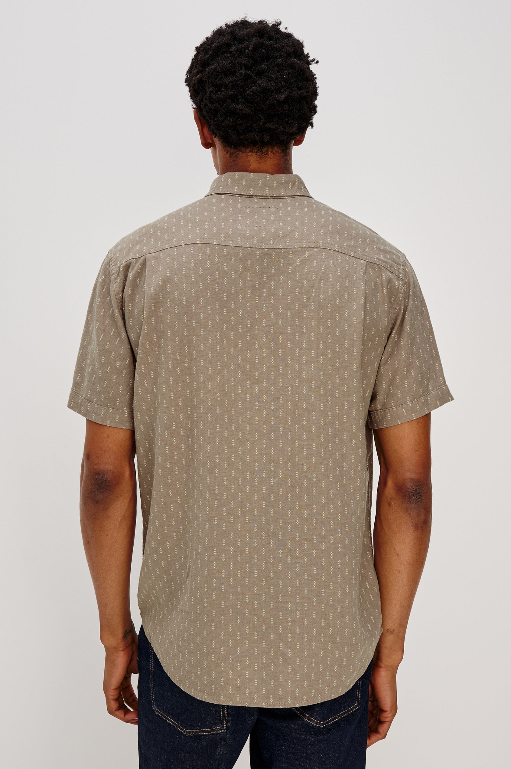 Carson button front collared shirt with short sleeves and a front patch pocket in Arrow Dot Crater colorway. Back View Shown on Model.