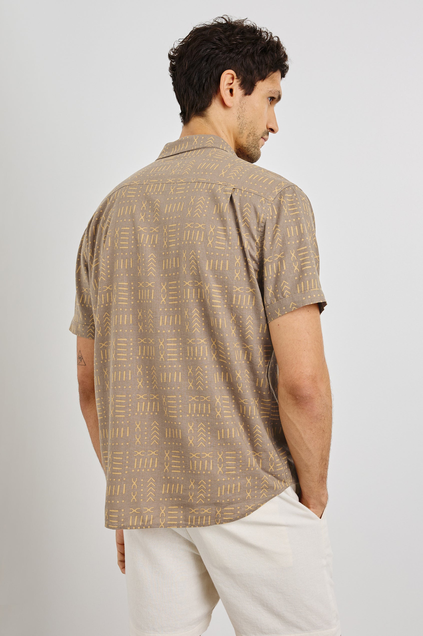 Carson Collared Button Front Shirt with Short Sleeves and a Chest Pocket in Bali Batik Brown Colorway. Back View Shown on Model.