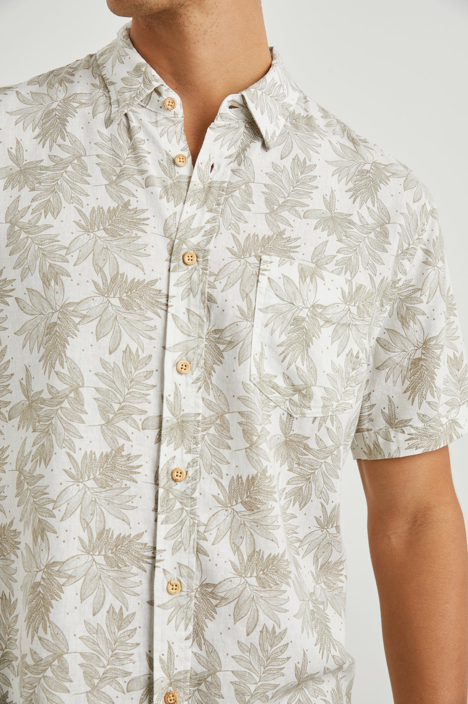 Carson Short Sleeve Button Up with a Chest Patch Pocket in Dotted Fronds Seneca Colorway, on White - Front View Featured on Model