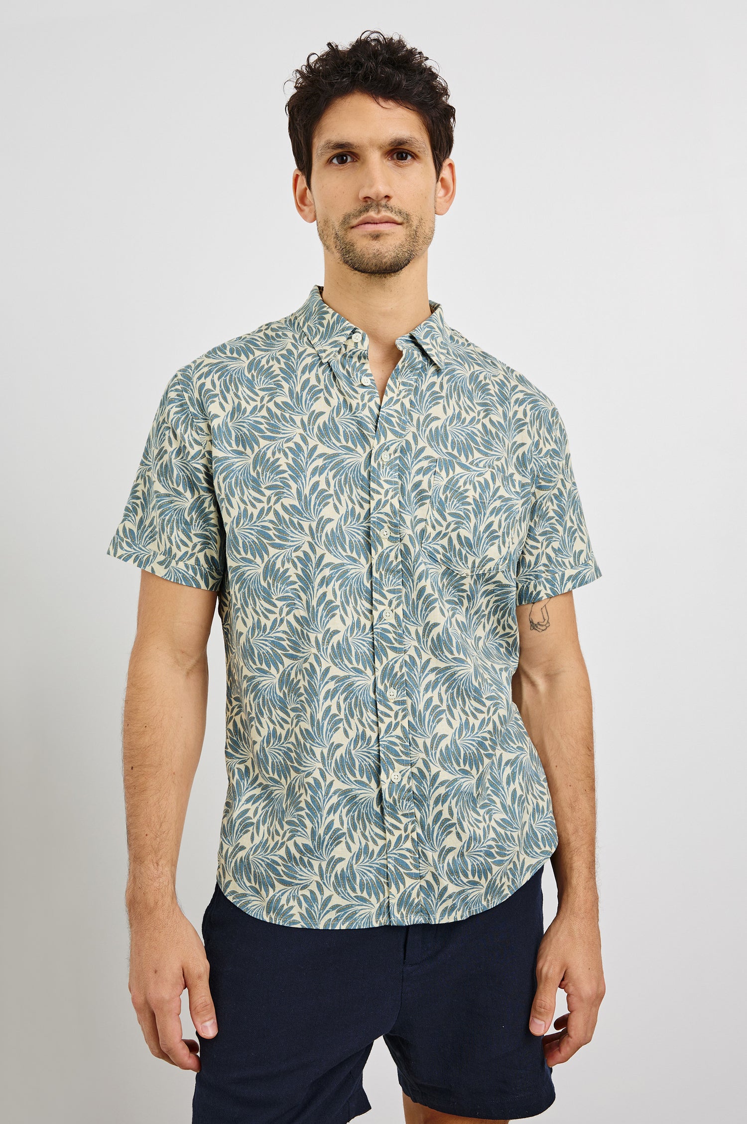 Carson Collared Button Front Shirt with Short Sleeves and a Chest Pocket in Ecru Banana Leaf Colorway. Front View Shown on Model.