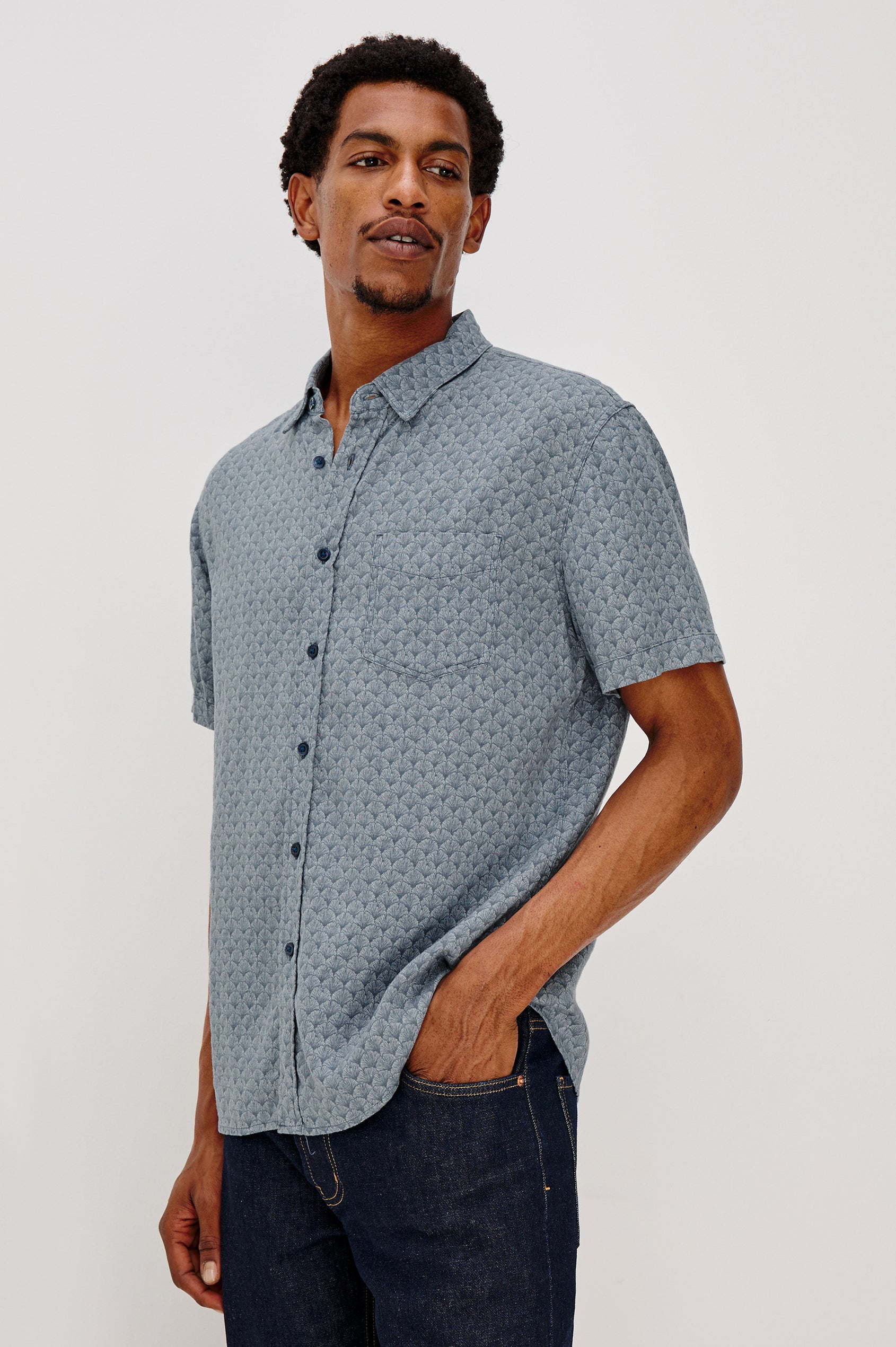 Carson button front collared shirt with short sleeves and a front patch pocket in Ginkgo Blue Ice colorway. Front View Shown on Model.