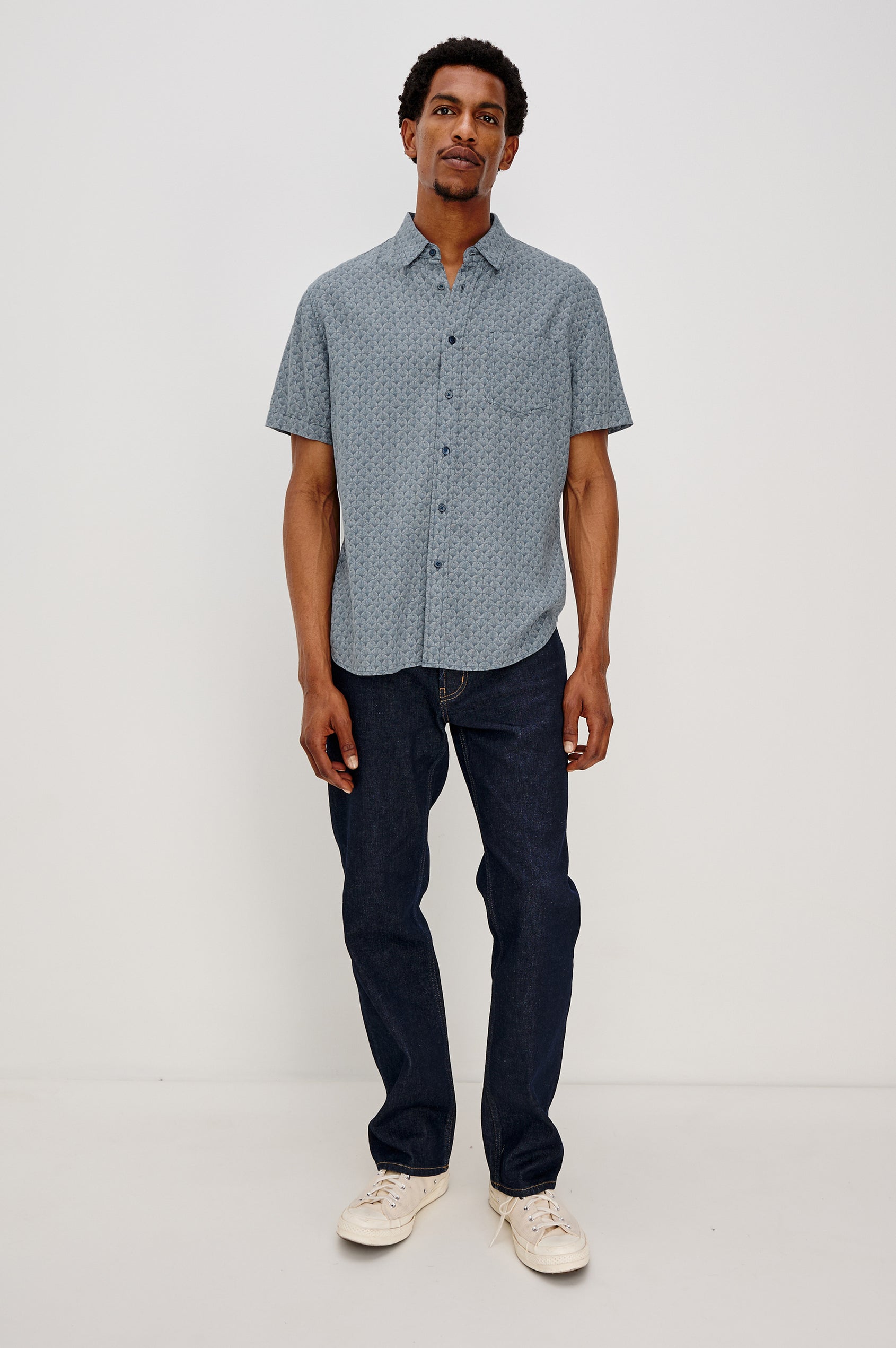 Carson button front collared shirt with short sleeves and a front patch pocket in Ginkgo Blue Ice colorway. Full Body Front View Shown on Model.