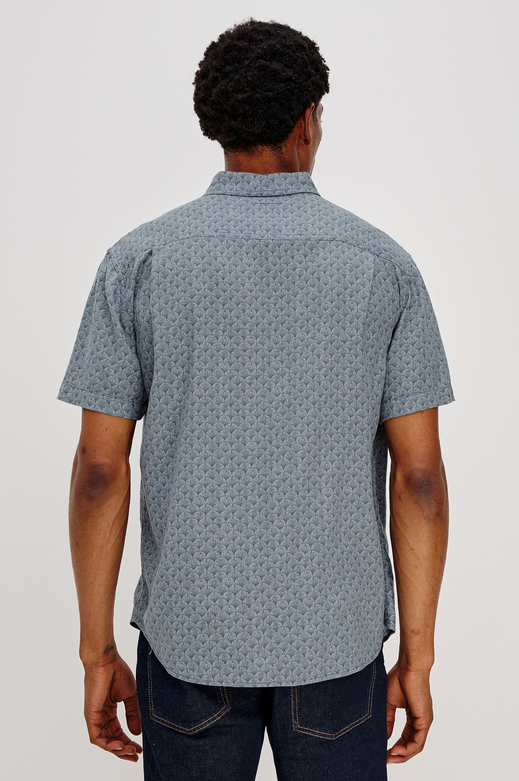 Carson button front collared shirt with short sleeves and a front patch pocket in Ginkgo Blue Ice colorway. Back View Shown on Model.