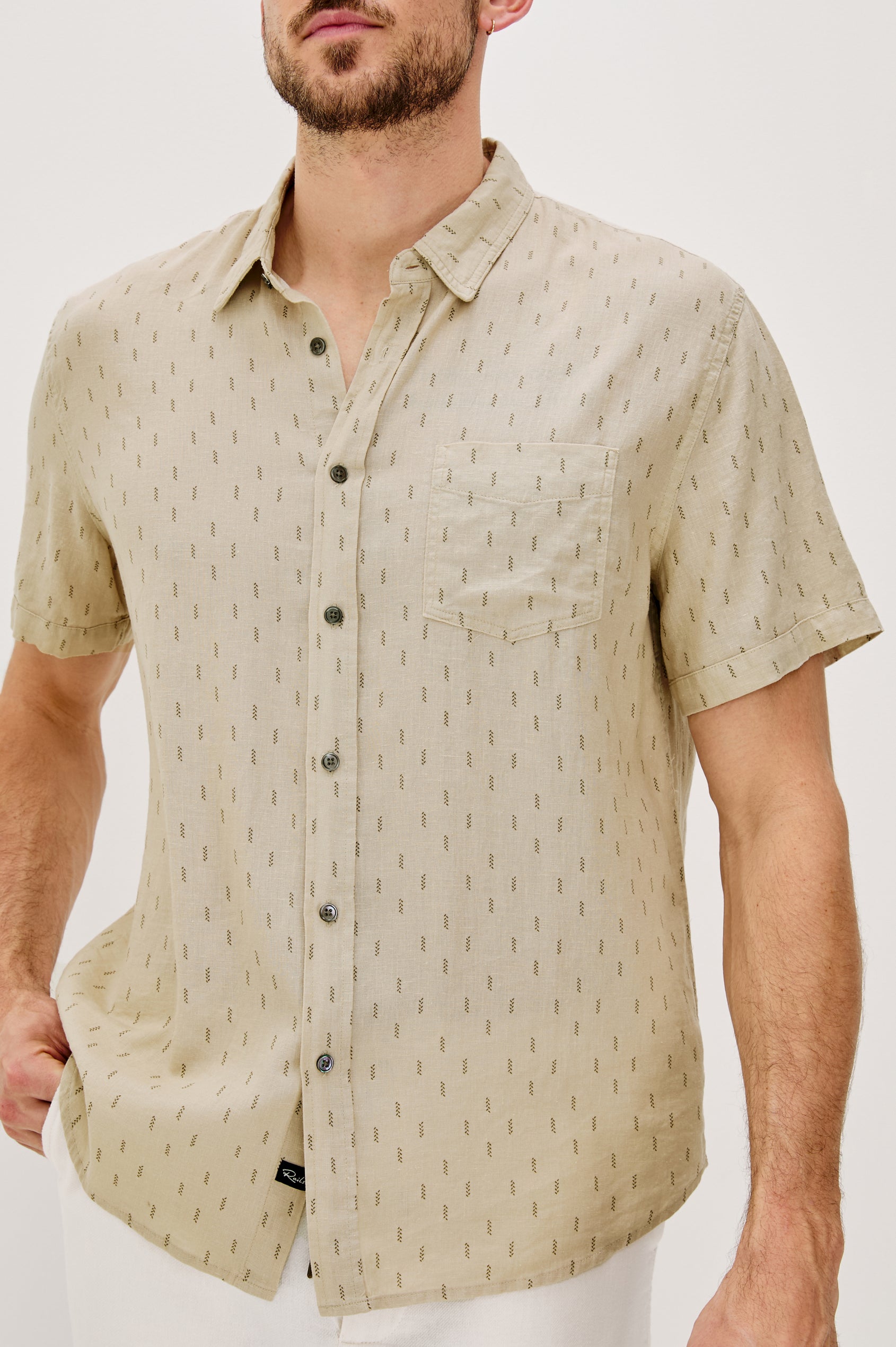 Carson linen short sleeve button down with a collar and front chest pocket in Louis Leaf Khaki colorway - close up of details