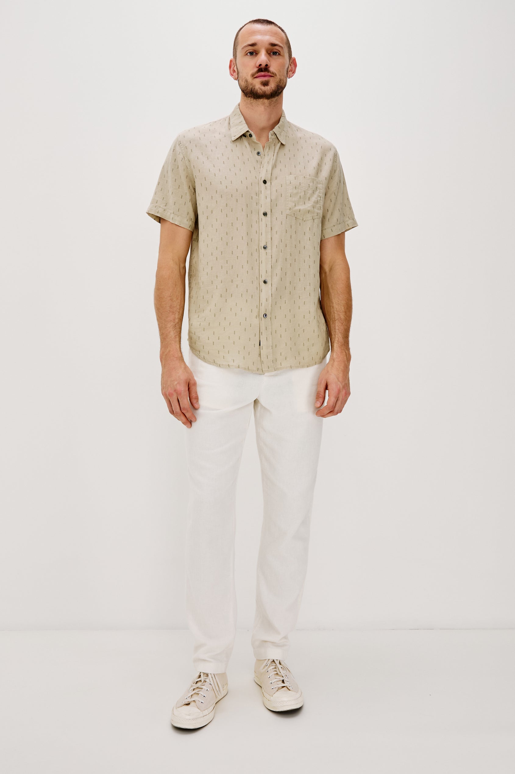 Carson linen short sleeve button down with a collar and front chest pocket in Louis Leaf Khaki colorway - full body front view