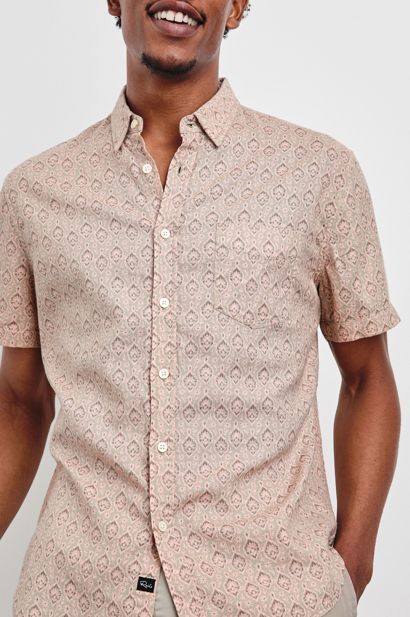 Carson linen short sleeve button down with a collar and ornamental pattern in Batik Flamingo - close up of details