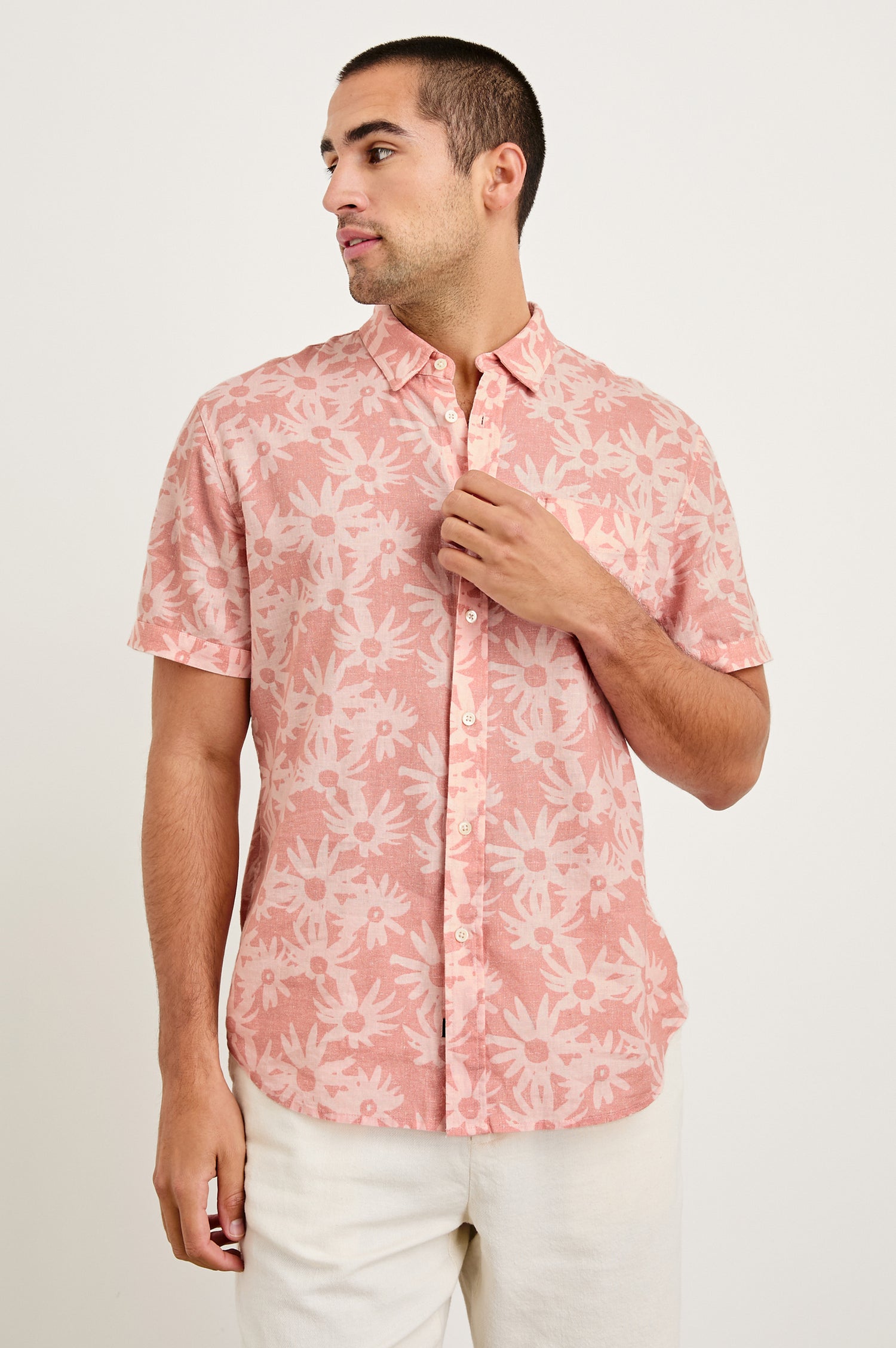 Carson linen short sleeve button down with a collar and floral pattern in Perennial Pink - front view on model