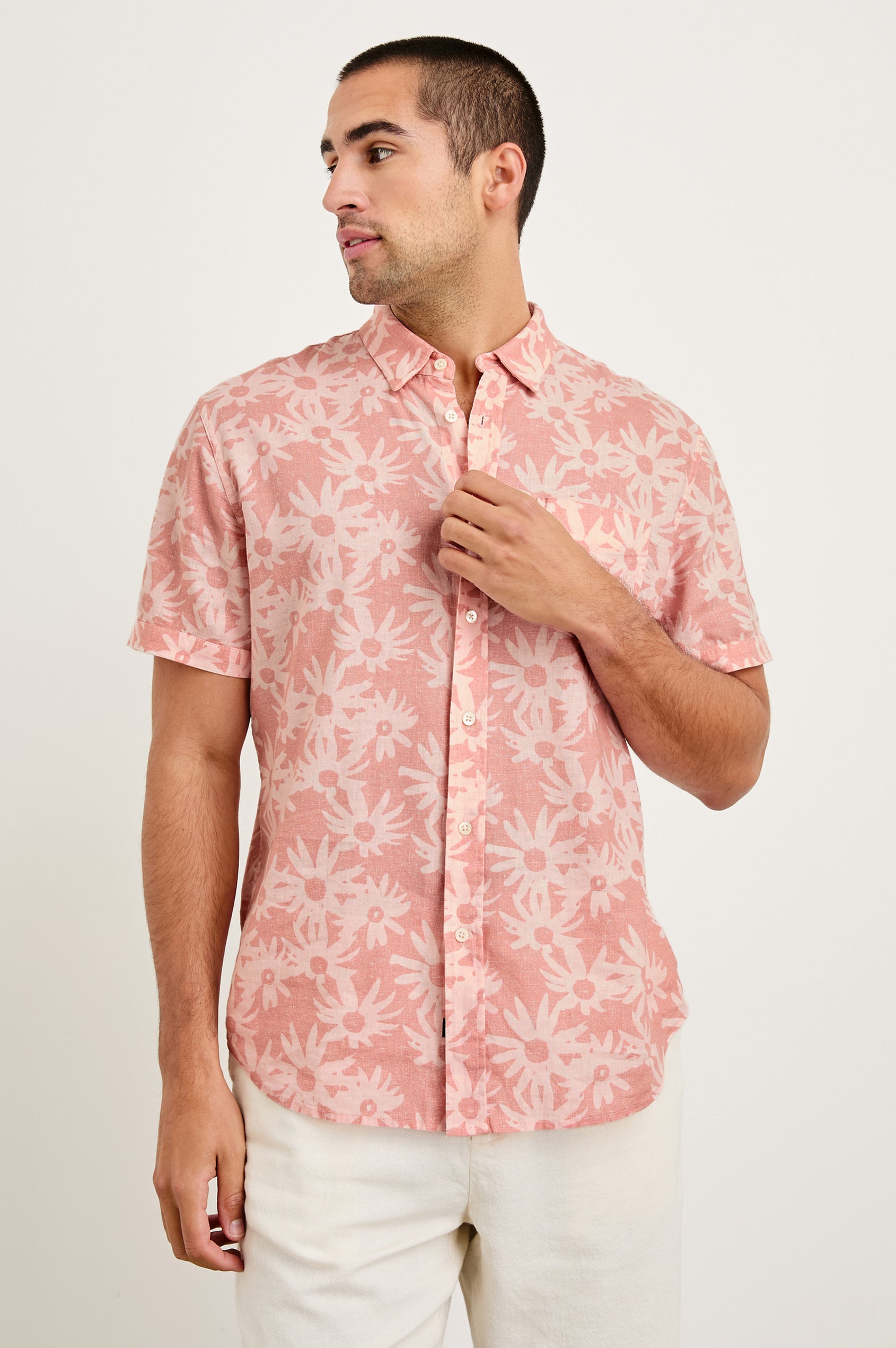 Carson linen short sleeve button down with a collar and floral pattern in Perennial Pink - front view on model