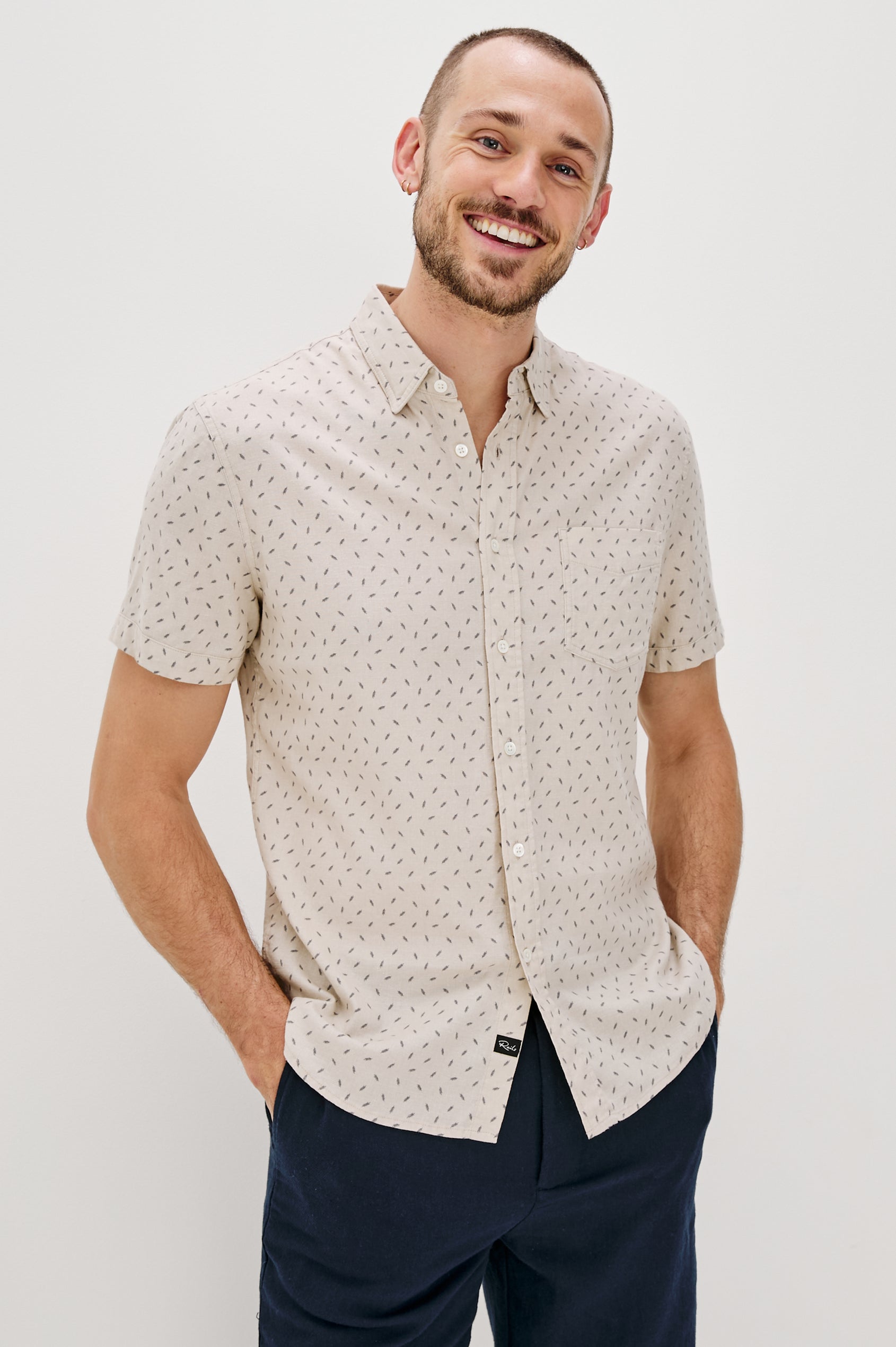 Carson linen short sleeve button down with a collar and front chest pocket in Petite Fronds Hummus colorway - front view on model