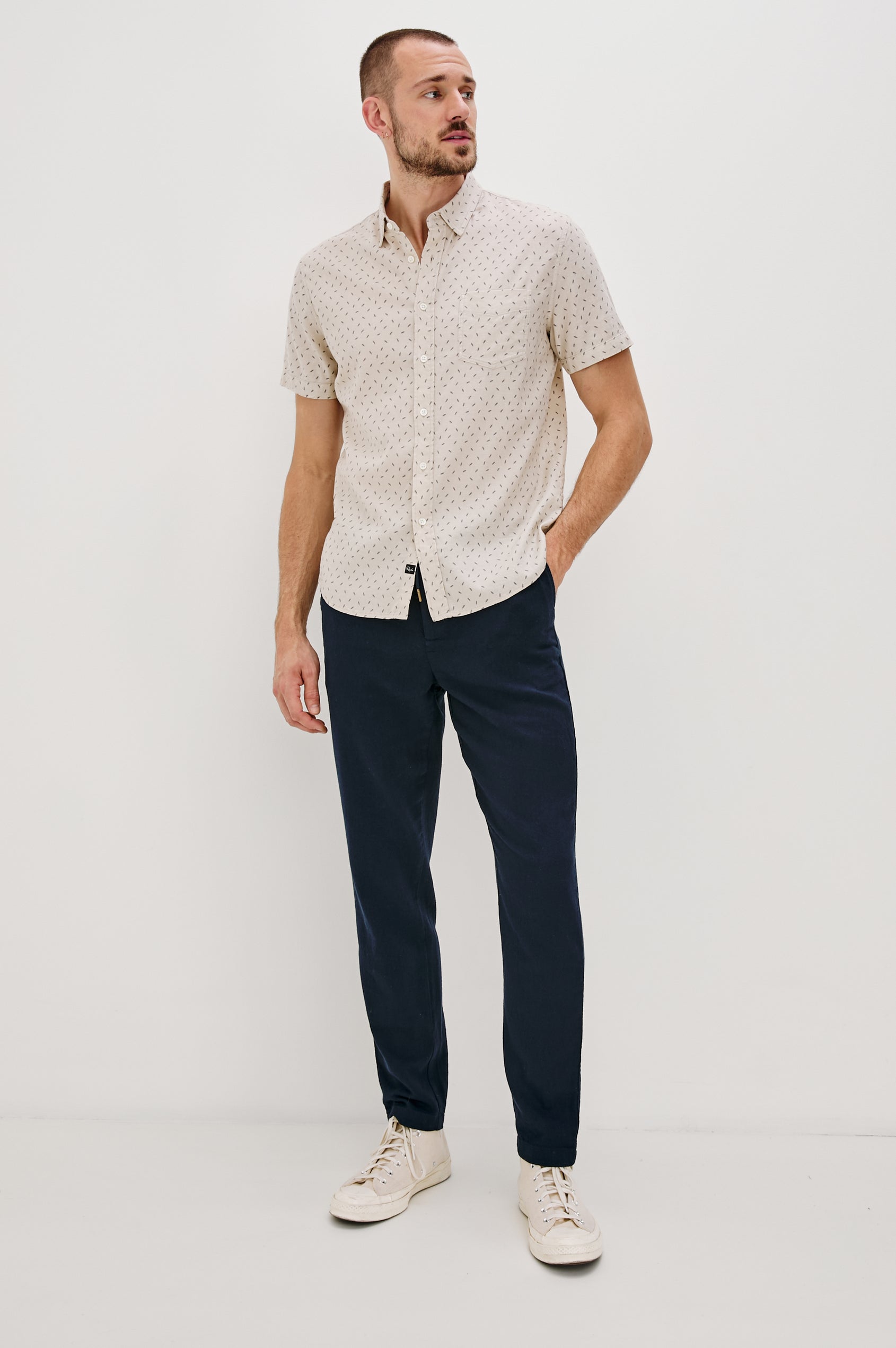 Carson linen short sleeve button down with a collar and front chest pocket in Petite Fronds Hummus colorway - full body front view on model