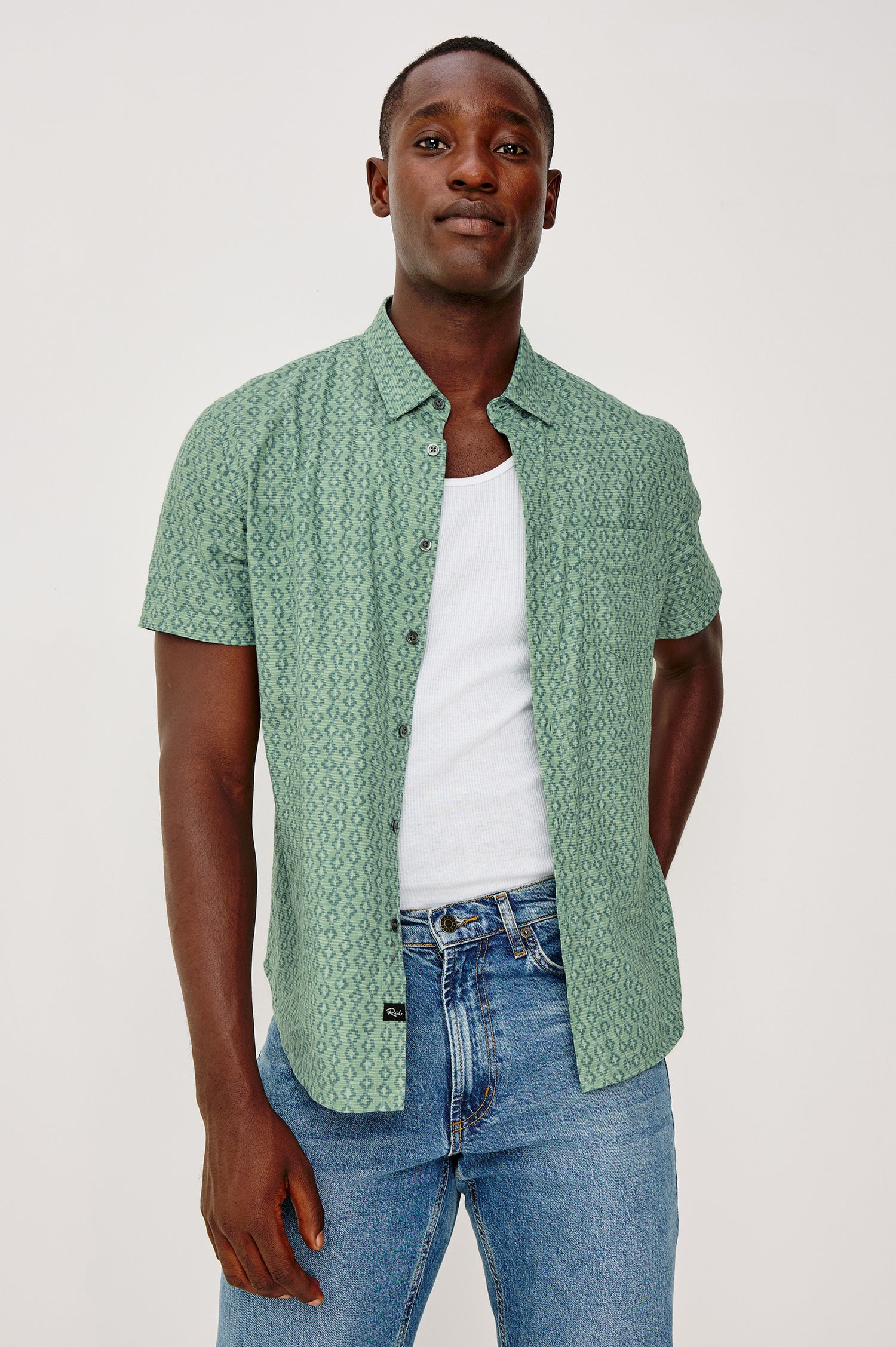 Carson Button Front Shirt in Linen Blend With Collar, Short Sleeves, Chest Patch Pocket, and Classic Fit in Batik Aqua Colorway - Upper Body Front View Featured on Model