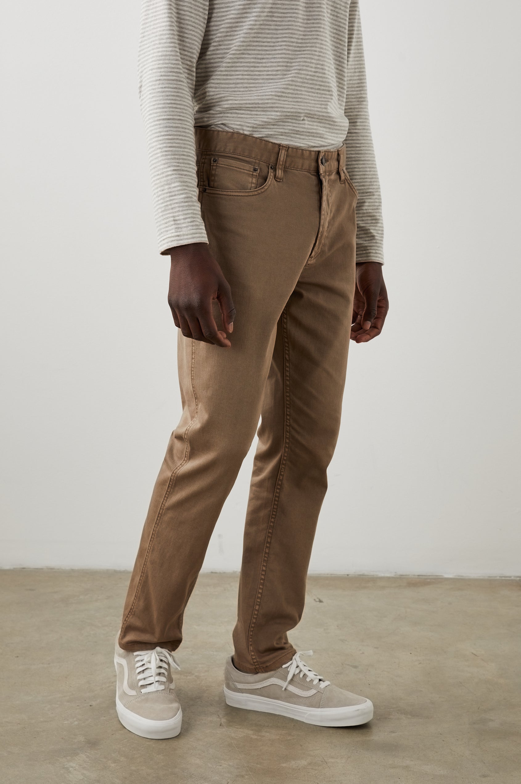 Carver Pants with Belt Loops, Two Front Pockets plus a Coin Pocket and Two Back Patch Pockets in Cacao Colorway - Side View Featured on Model