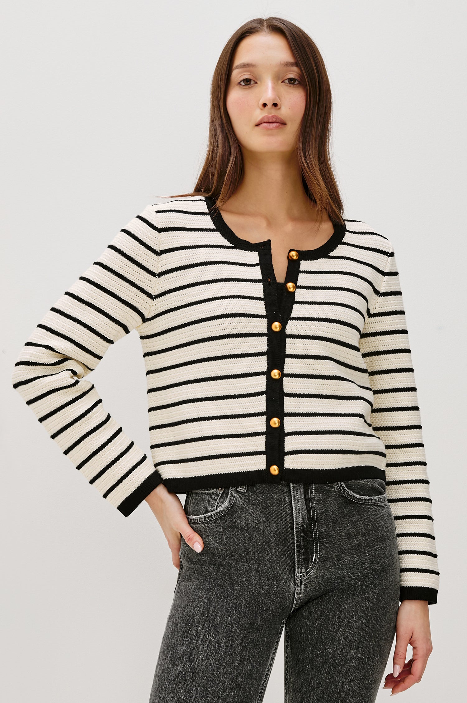 Catania button-front cardigan in an Ivory and Black horizontal stripe knit with a slightly cropped fit - front view featured on model.
