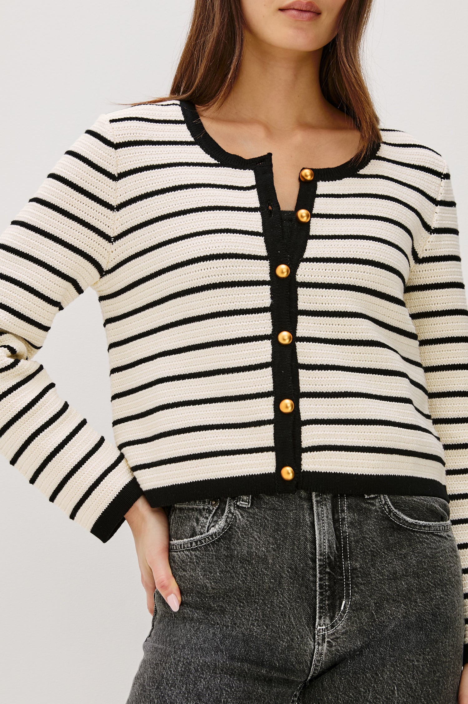 Catania button-front cardigan in an Ivory and Black horizontal stripe knit with a slightly cropped fit - front view featured on model.