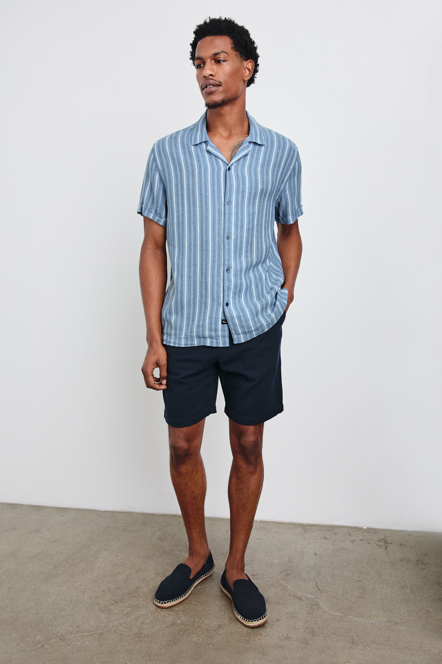 Cayman short sleeve shirt with contrast front buttons in Coastal Blue Stripe - full body front view on model