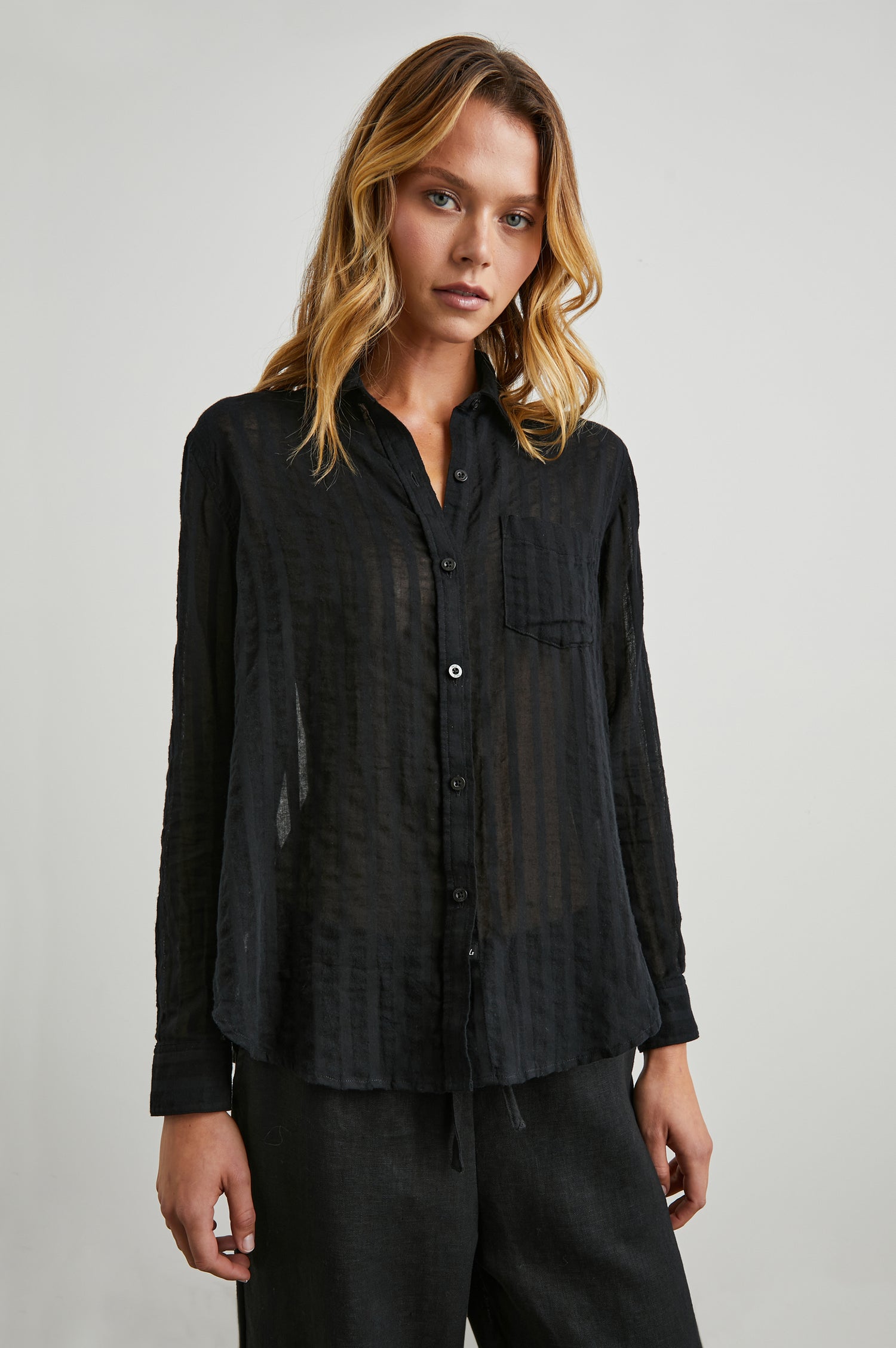 Charli Long-Sleeve Button up with a Chest Patch Pocket in Black Shadow Stripe Colorway, with Vertical Solid and Gauzy Black Stripes  - Front View Featured on Model