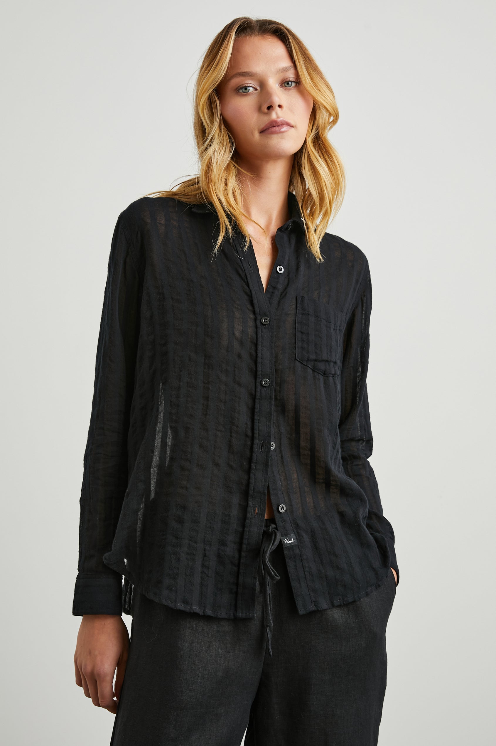 Charli Long-Sleeve Button up with a Chest Patch Pocket in Black Shadow Stripe Colorway, with Vertical Solid and Gauzy Black Stripes  - Front View Featured on Model