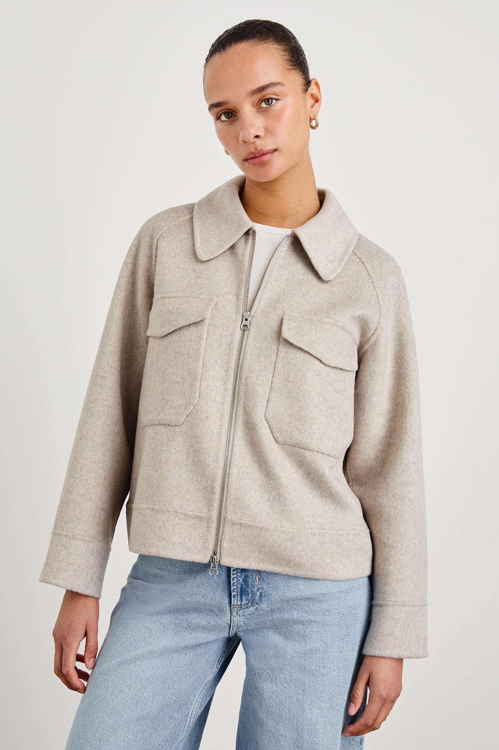 Cheyenne fitted wool jacket with oversized pockets and collar in Oatmeal - front view on model, fully zipped