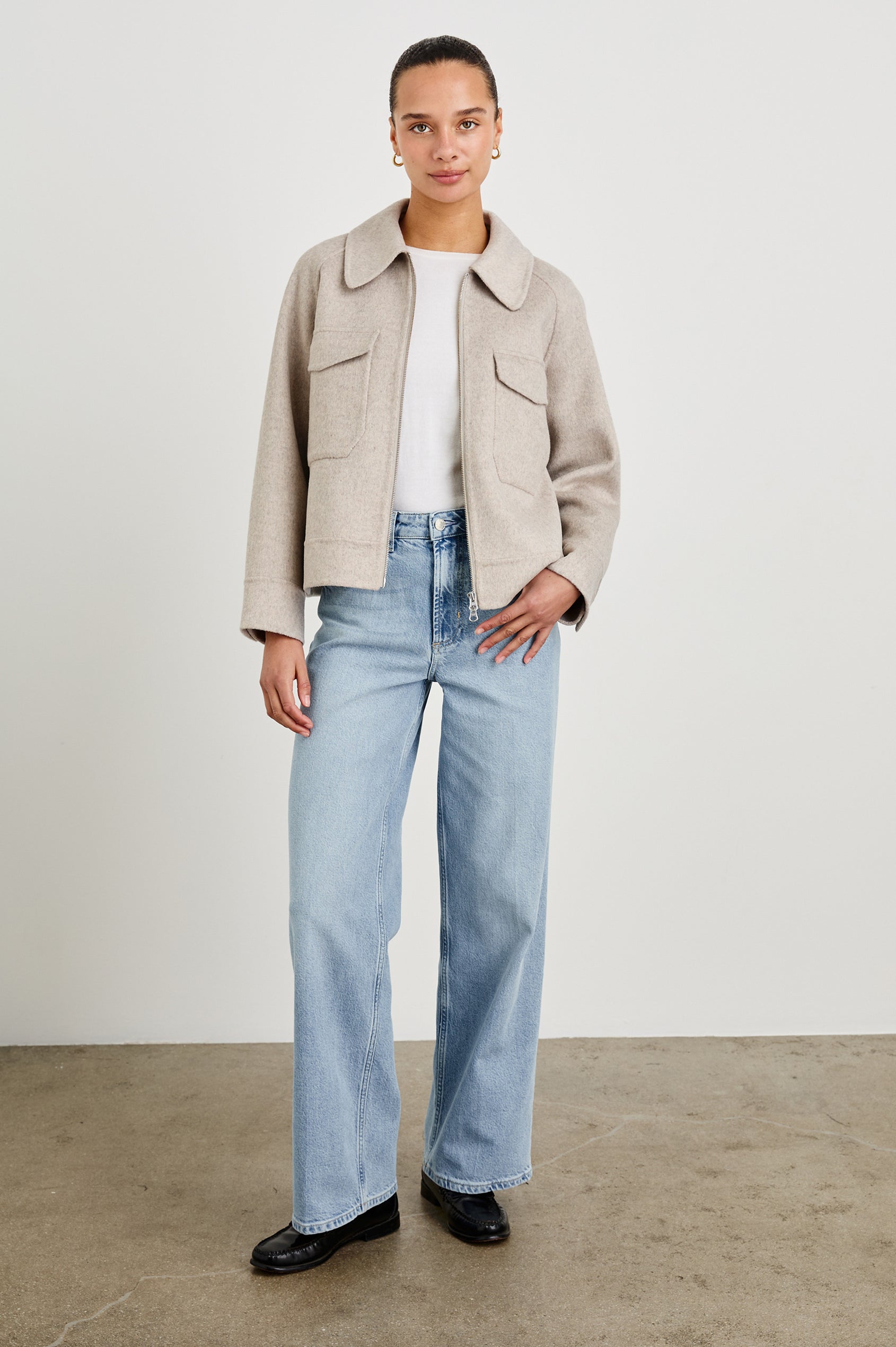 Cheyenne fitted wool jacket with oversized pockets and collar in Oatmeal - full body front view on model, unzipped