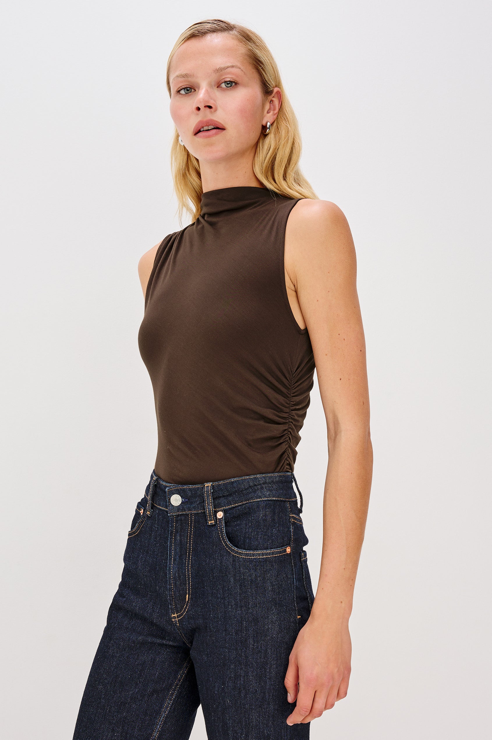 Christen Sleeveless Top with a Mock Neck and Ruching Along One Side Seam in Espresso Colorway - Front View Featured on Model