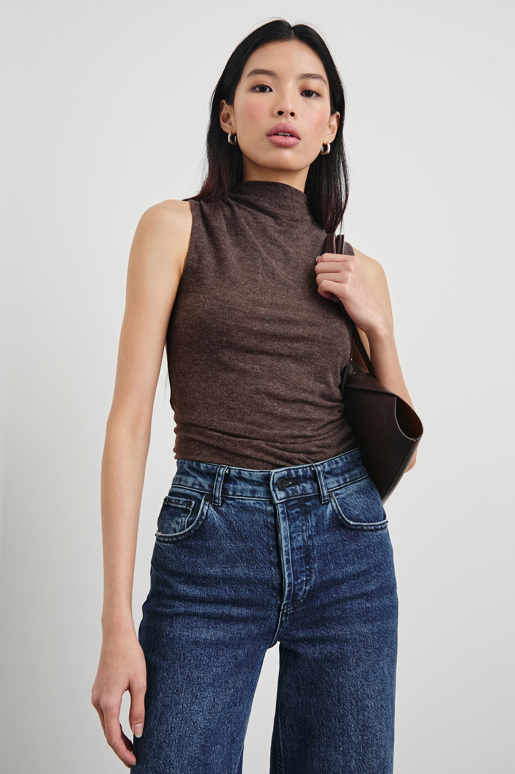 Christen Sleeveless Top with a Mock Neck and Ruching Along One Side Seam in Heather Brown Colorway - Front View Featured on Model