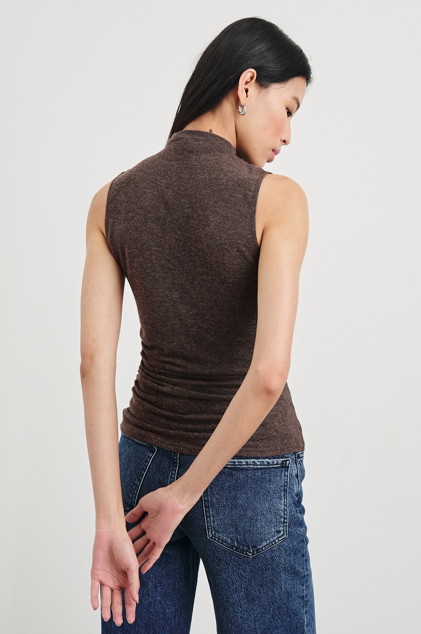 Christen Sleeveless Top with a Mock Neck and Ruching Along One Side Seam in Heather Brown Colorway - Back View Featured on Model