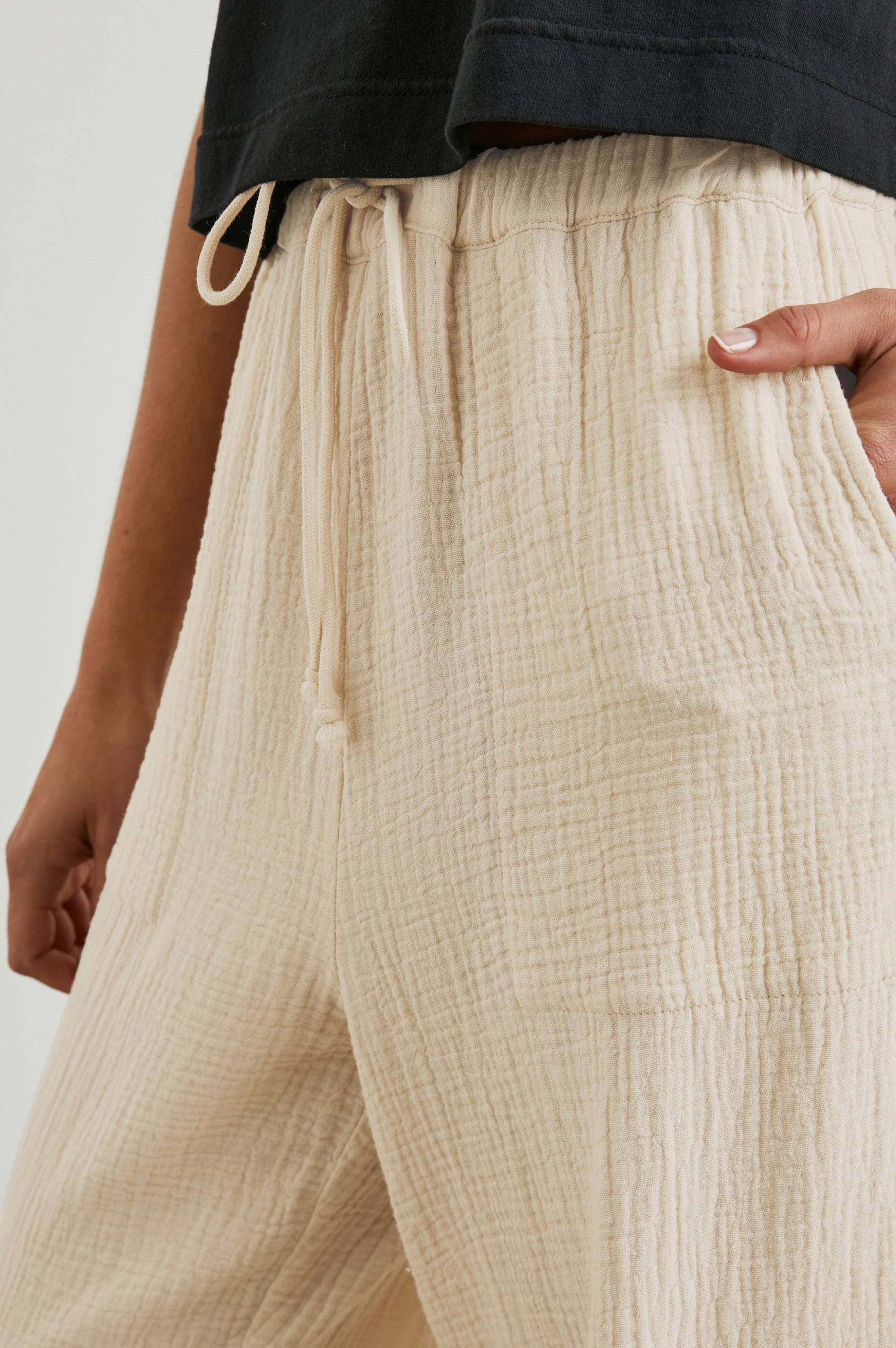 Christiano Pants with a Drawstring Waist, Two Front Pockets and Two Flap Side Pockets in Flax Colorway - Front View Featured on Model  