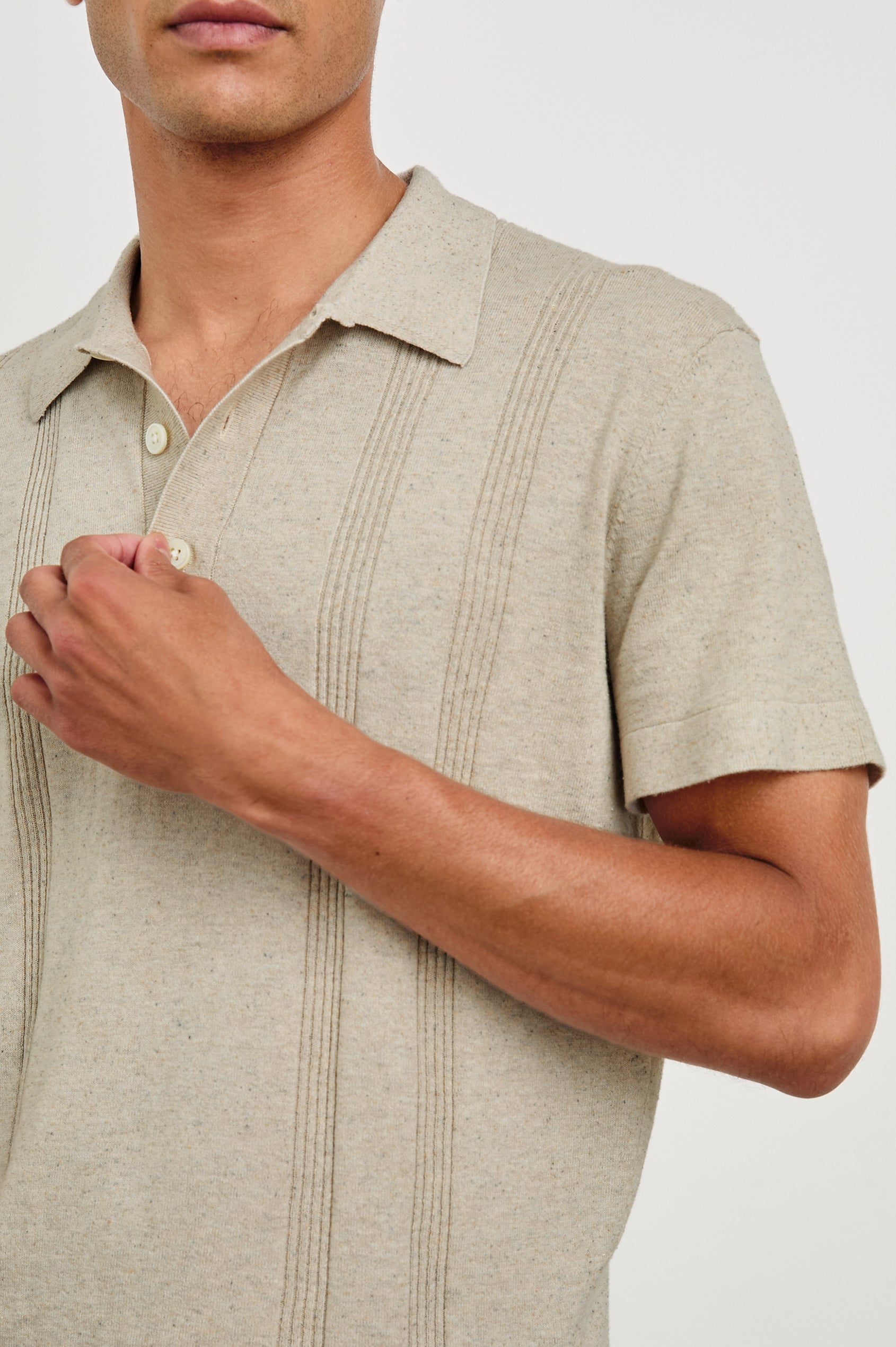 Cillian short sleeve cotton silk blend polo with three button placket and retro  front stripe details in Silversand - close up of details on model