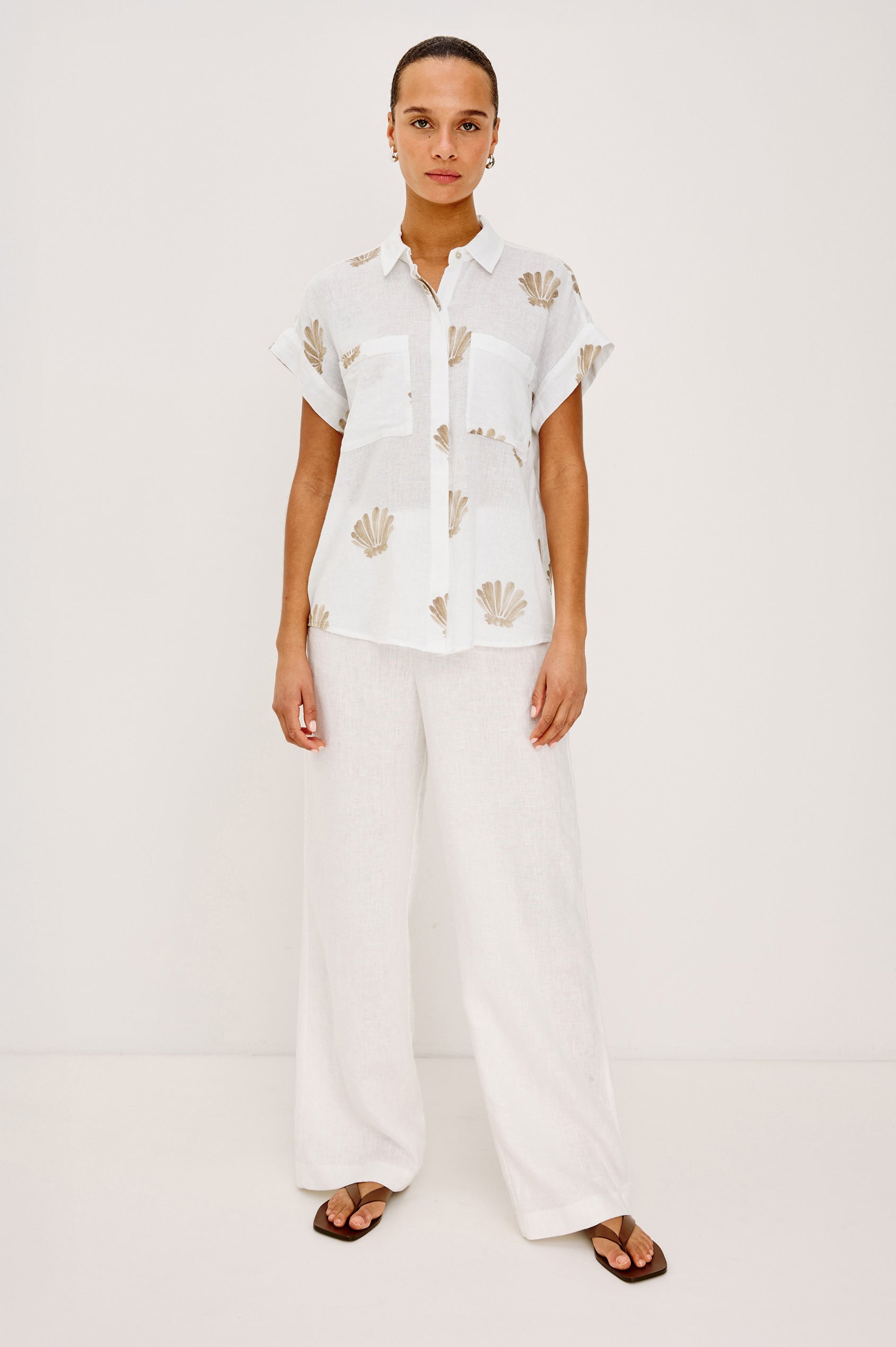 Cito Relaxed Button-Up Shirt in Linen With Collar, Chest Patch Pockets, and Cuffed Cap Sleeves in Taupe Seashells Colorway - Full Body Front View Featured on Model